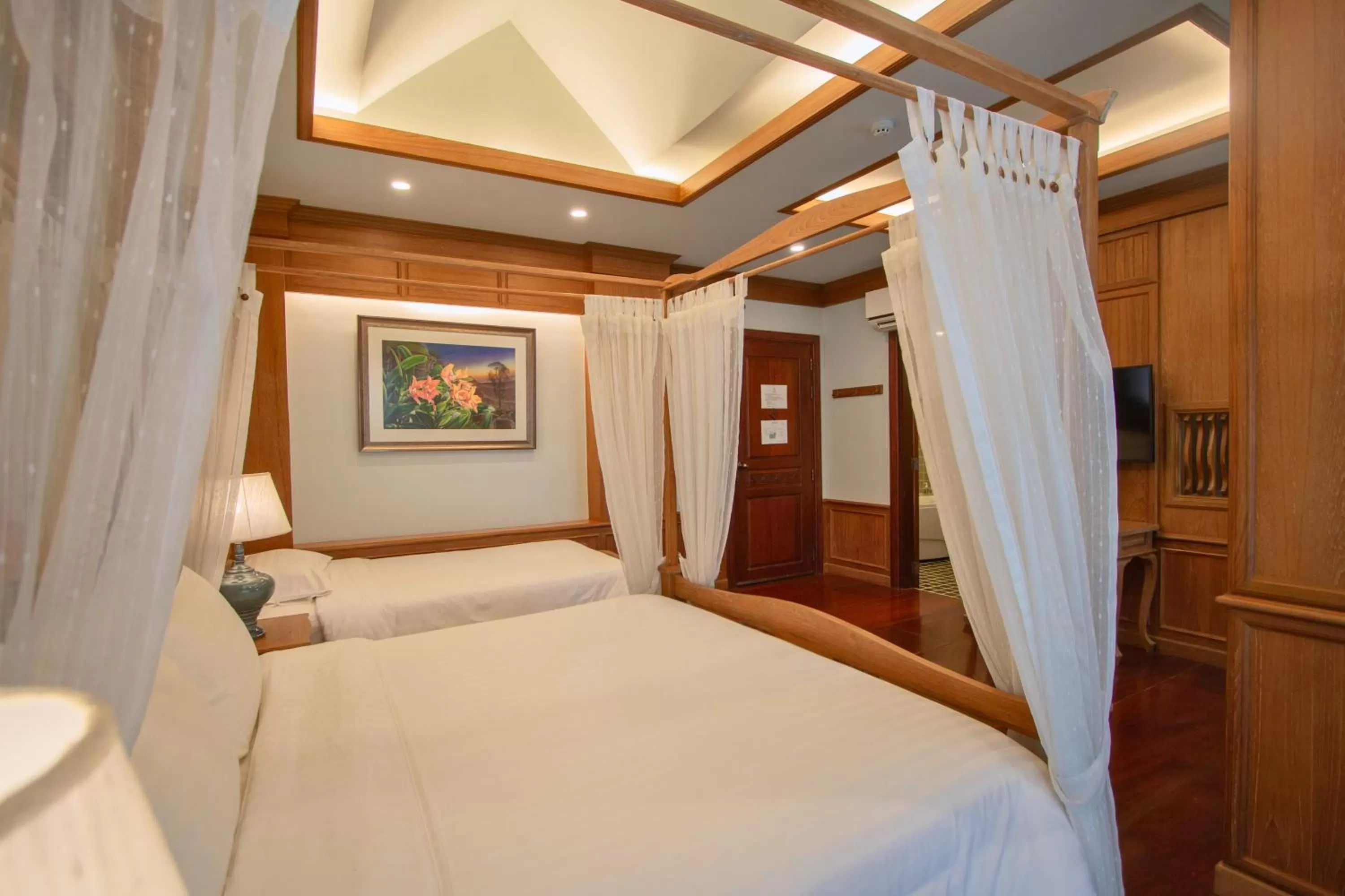 Bed in Rich Garden House Hotel