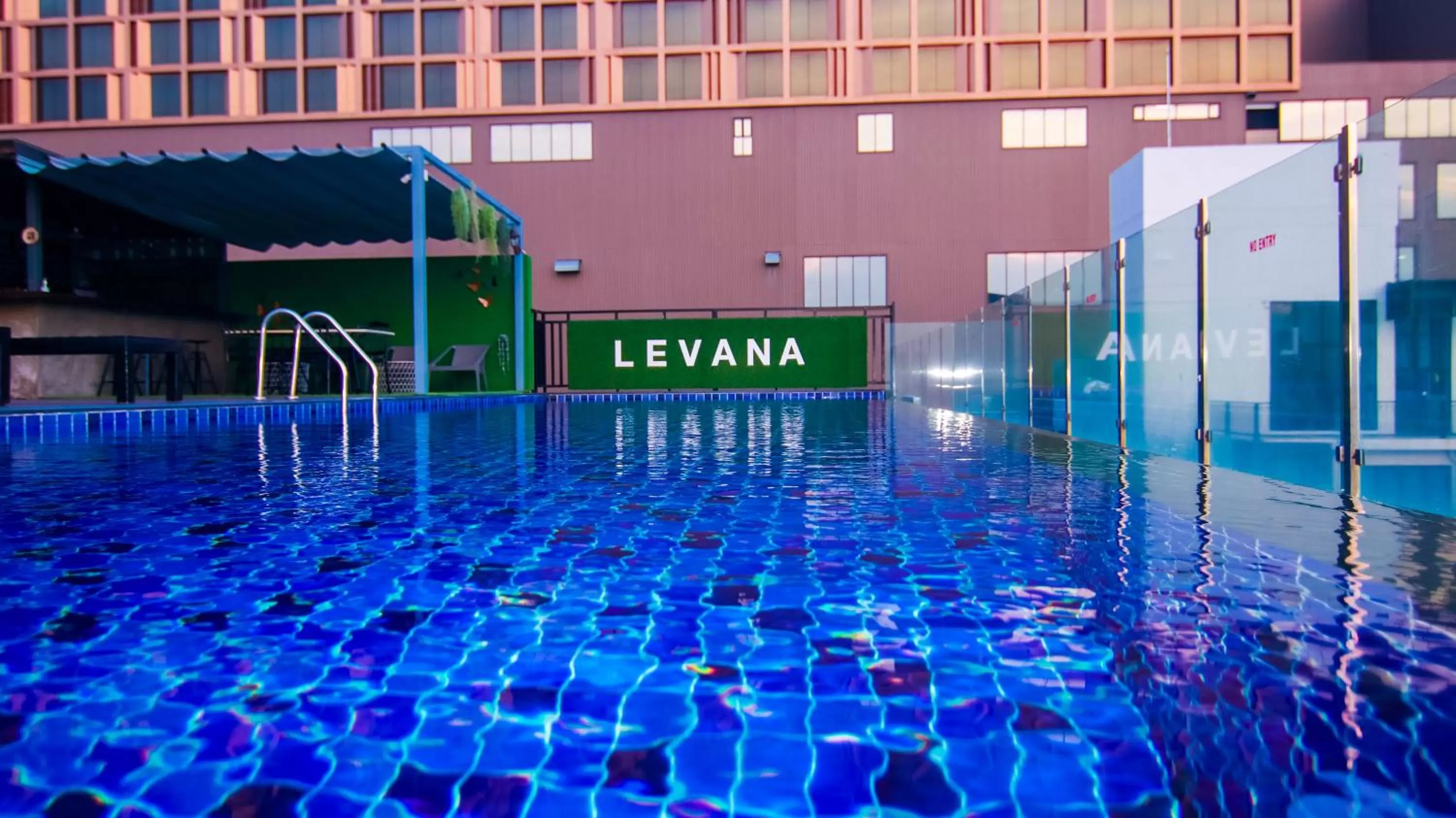 Swimming pool in Levana Pattaya Hotel - SHA Extra Plus