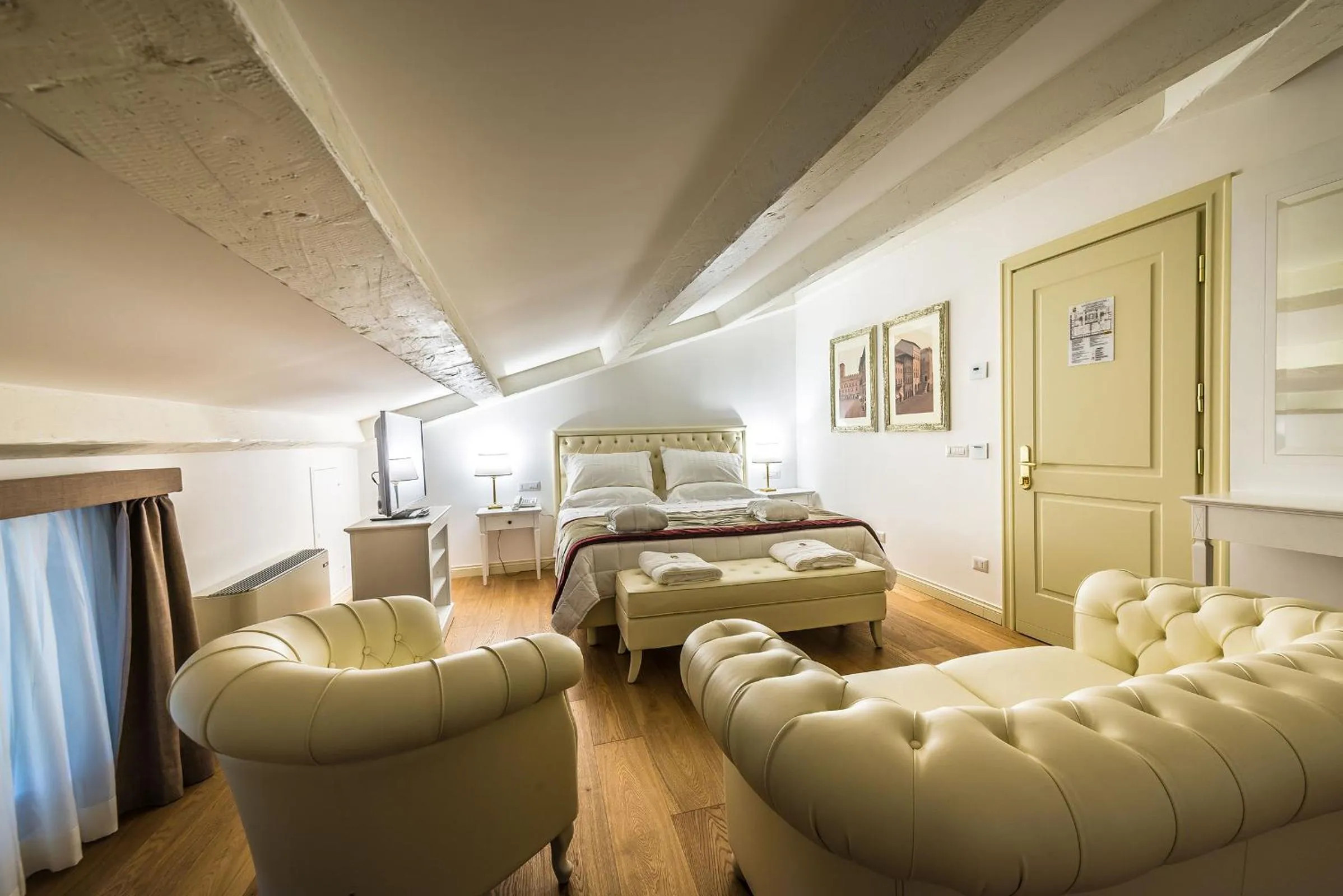 Seating area, Bed in Relais Paradiso Resort & Spa