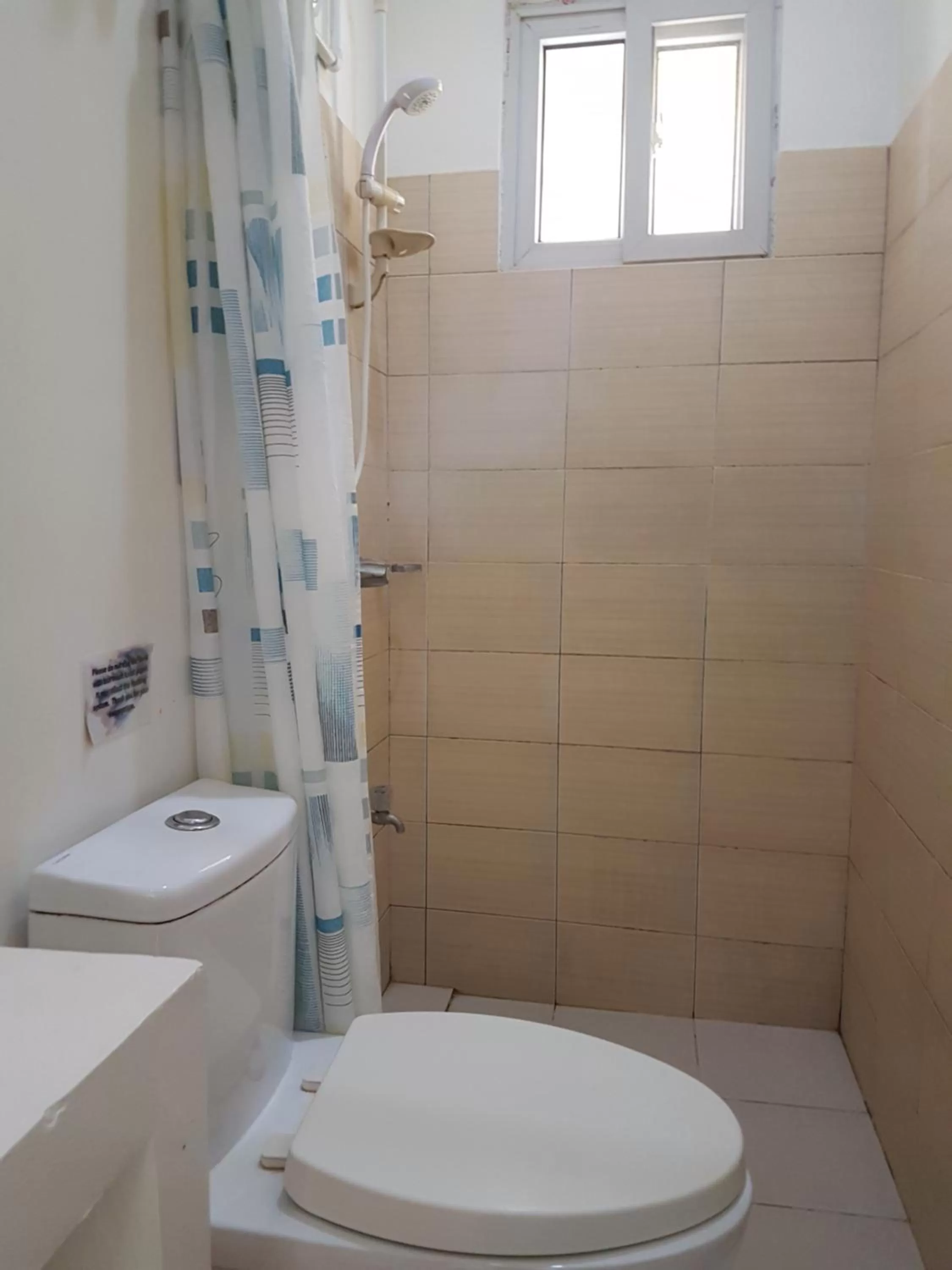 Toilet in Blue Lagoon Inn & Suites