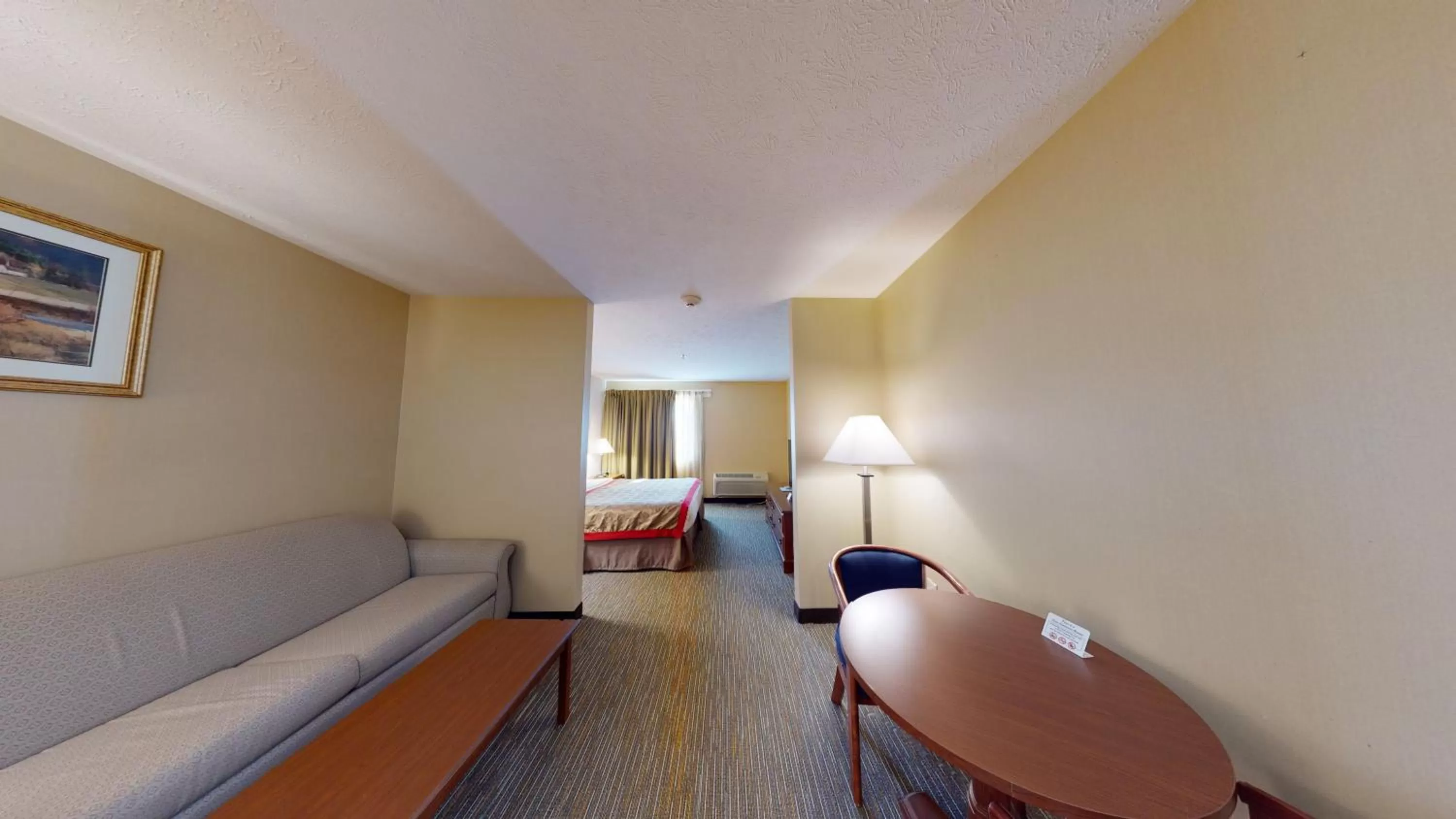 Seating area, Bed in Ramada by Wyndham Strasburg - Shenandoah Valley
