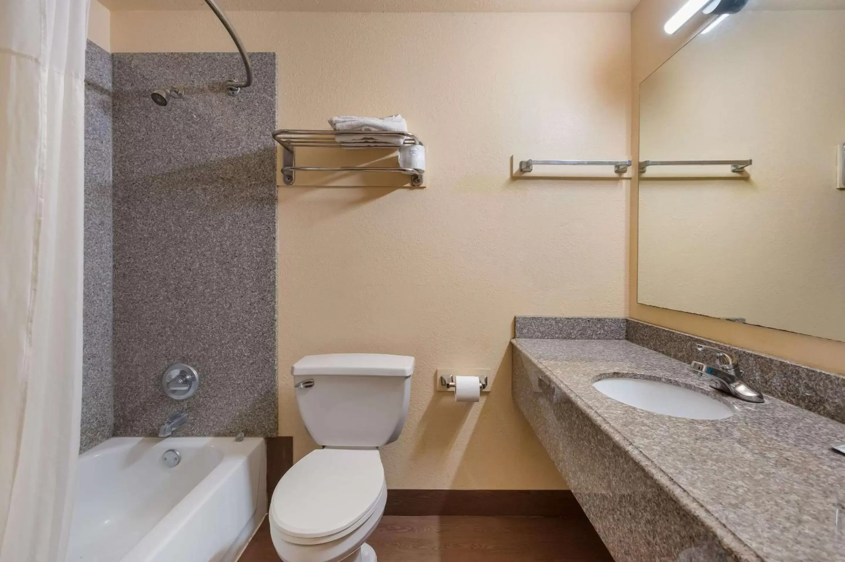 Bedroom, Bathroom in Rodeway Inn & Suites East