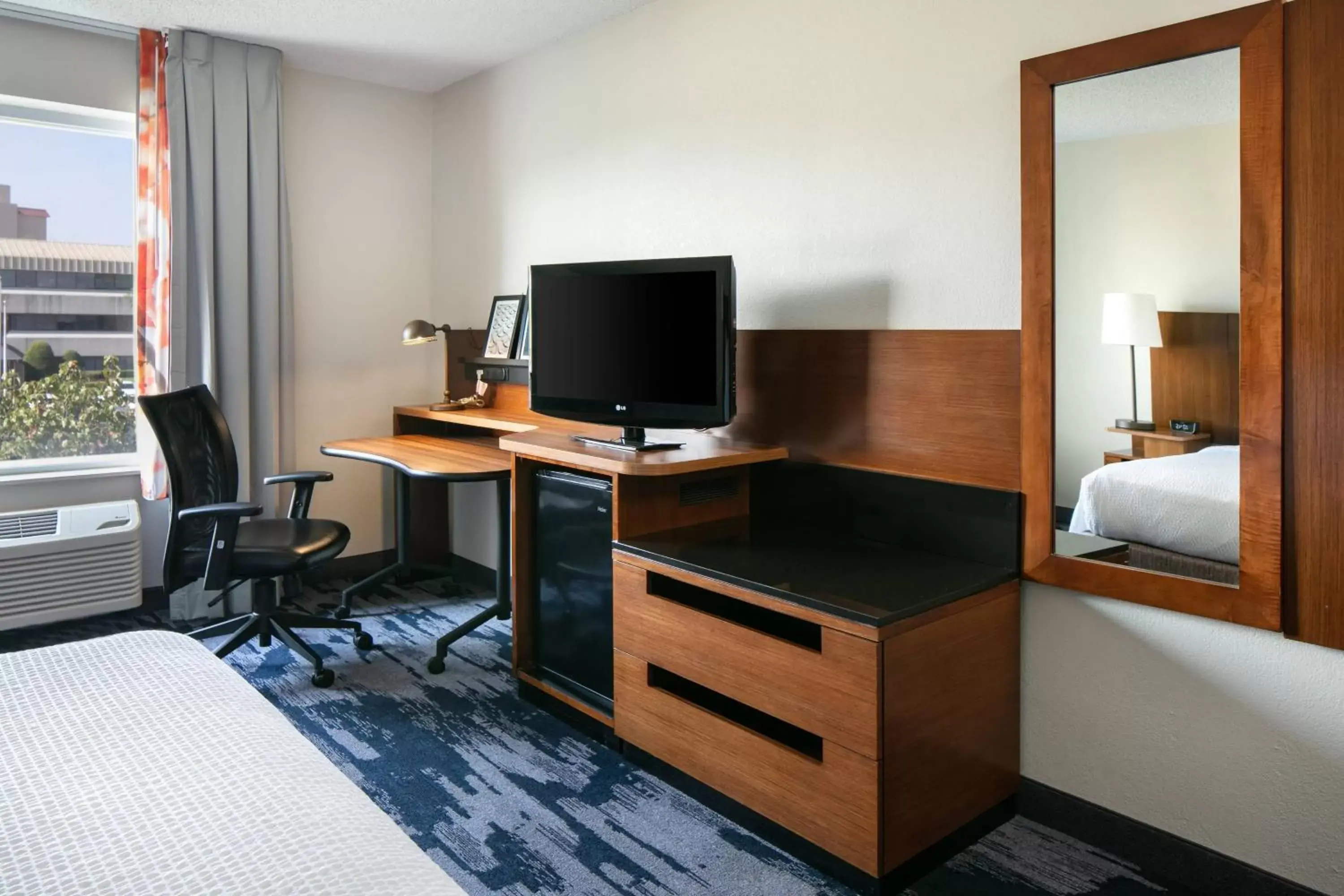 Photo of the whole room, TV/Entertainment Center in Fairfield Inn & Suites by Marriott Tulsa Central