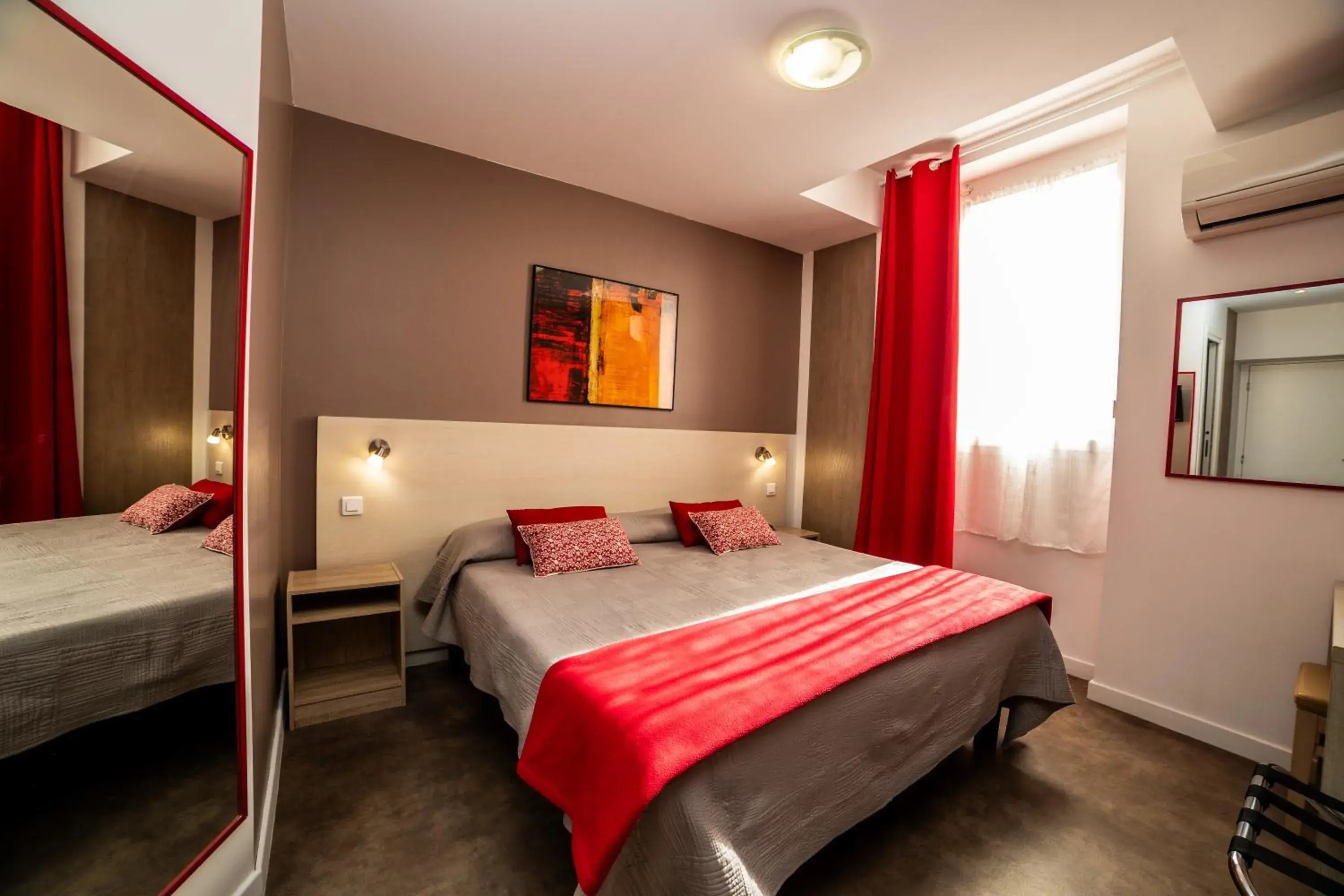 Bed in Hotel Parisien