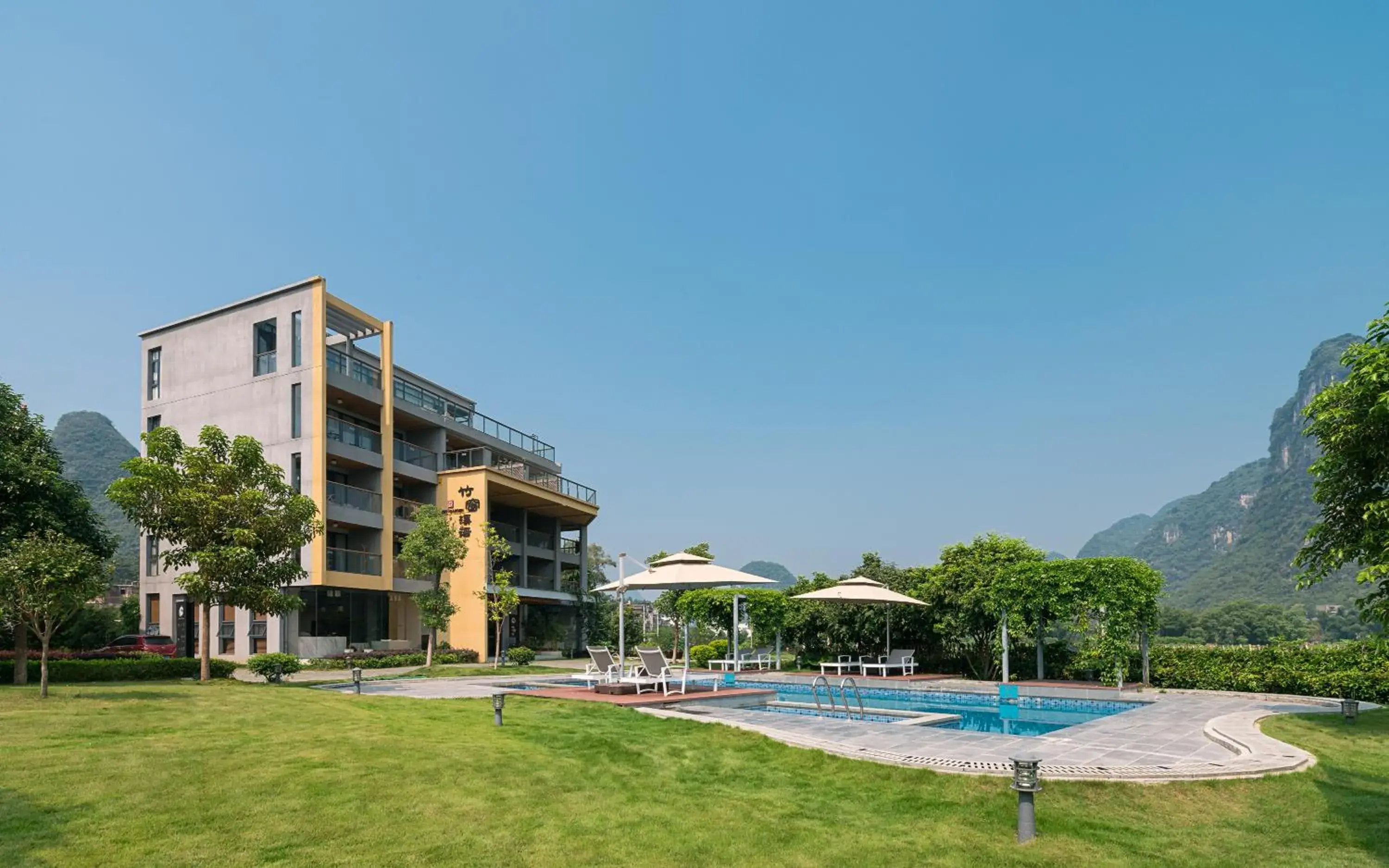 Property building, Swimming Pool in Yangshuo Zen Garden Resort