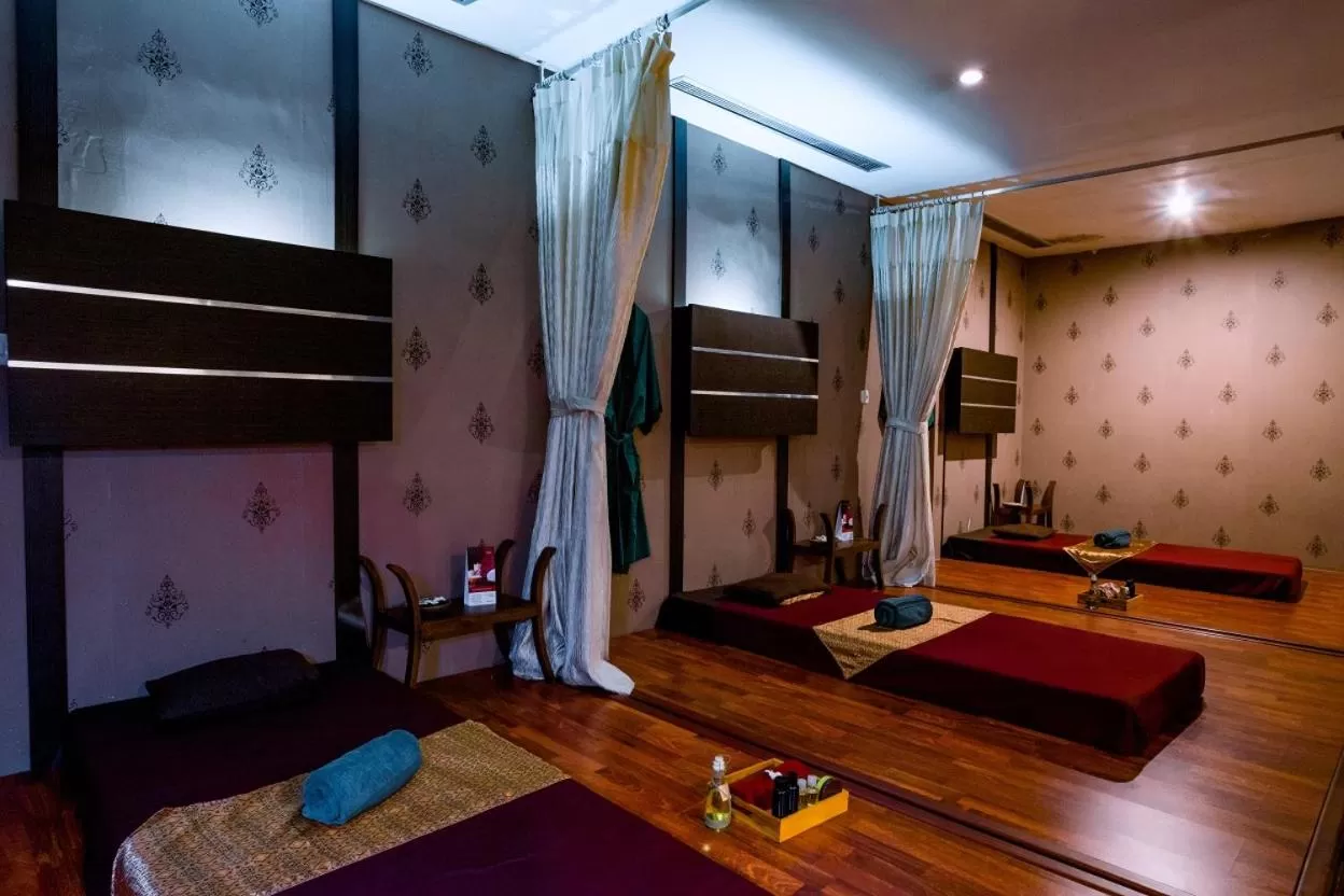 Bed in Emersia Hotel and Resort