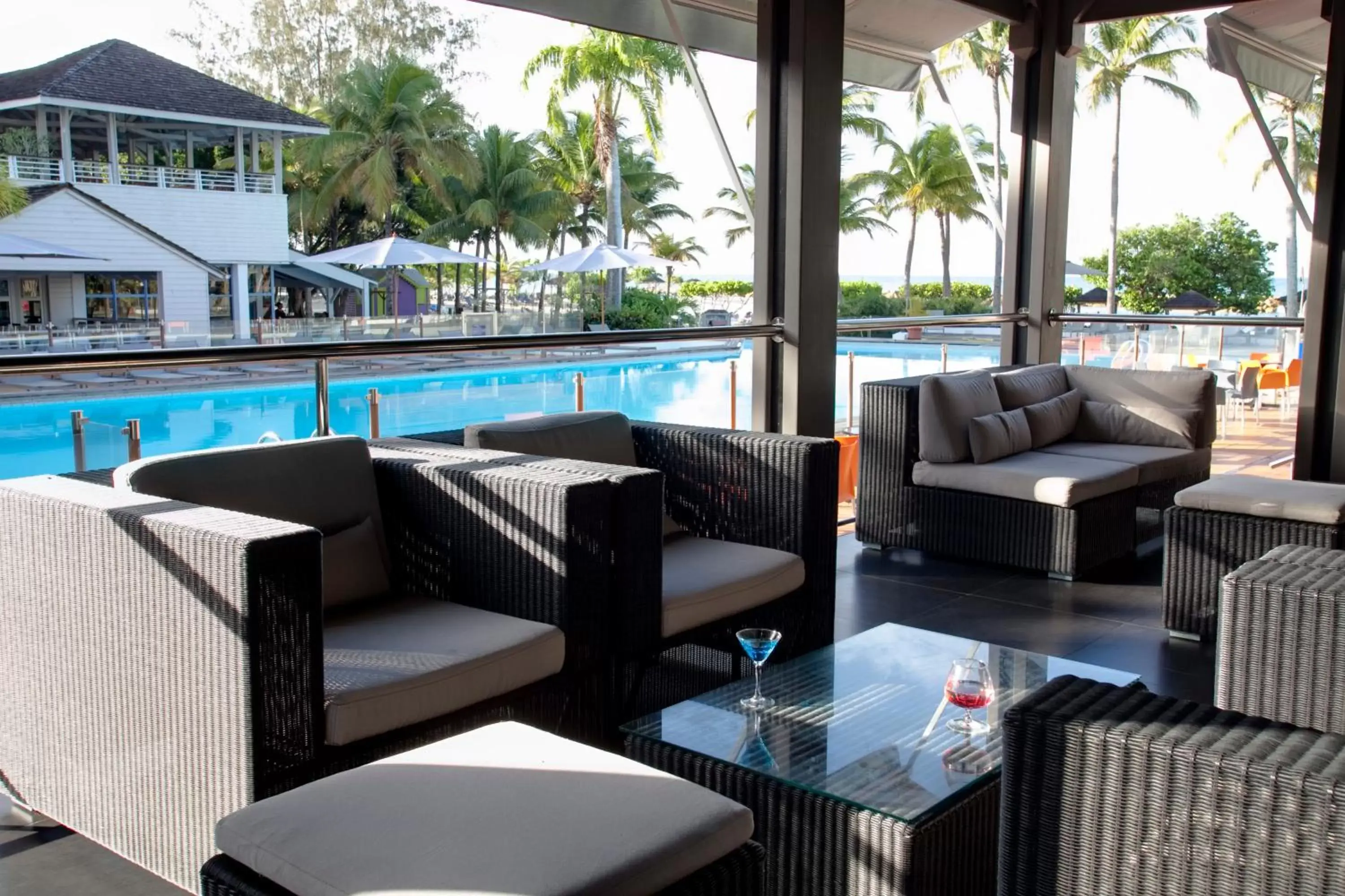Seating area, Pool View in Mahogany Hotel Residence & Spa