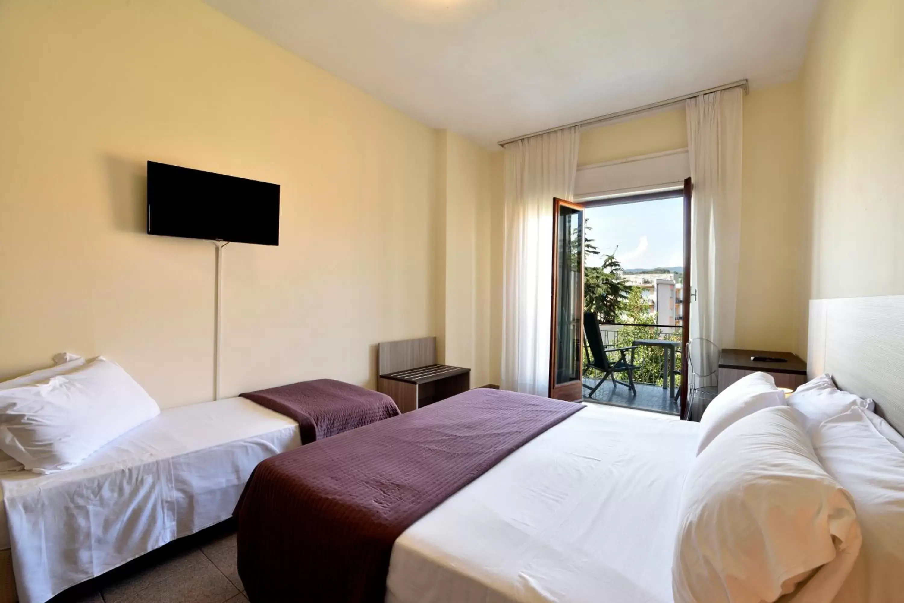 Photo of the whole room, Bed in Hotel Diano Marina Mhotelsgroup