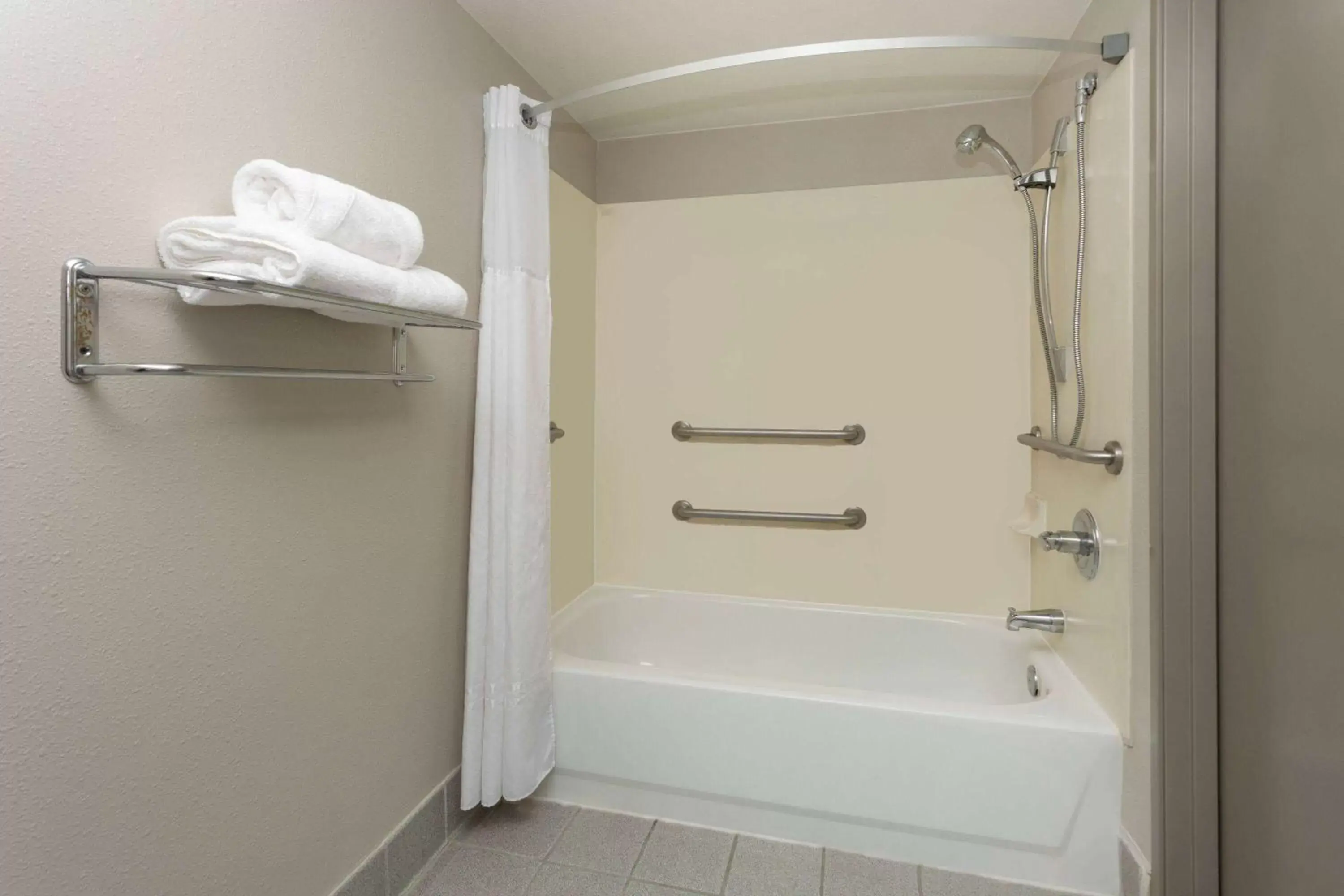 Bathroom in Days Inn & Suites by Wyndham Denver International Airport