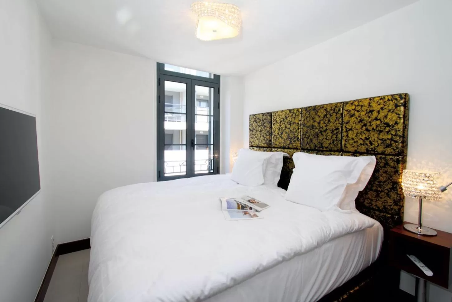 Photo of the whole room, Bed in GOLDEN TULIP CANNES HOTEL de PARIS