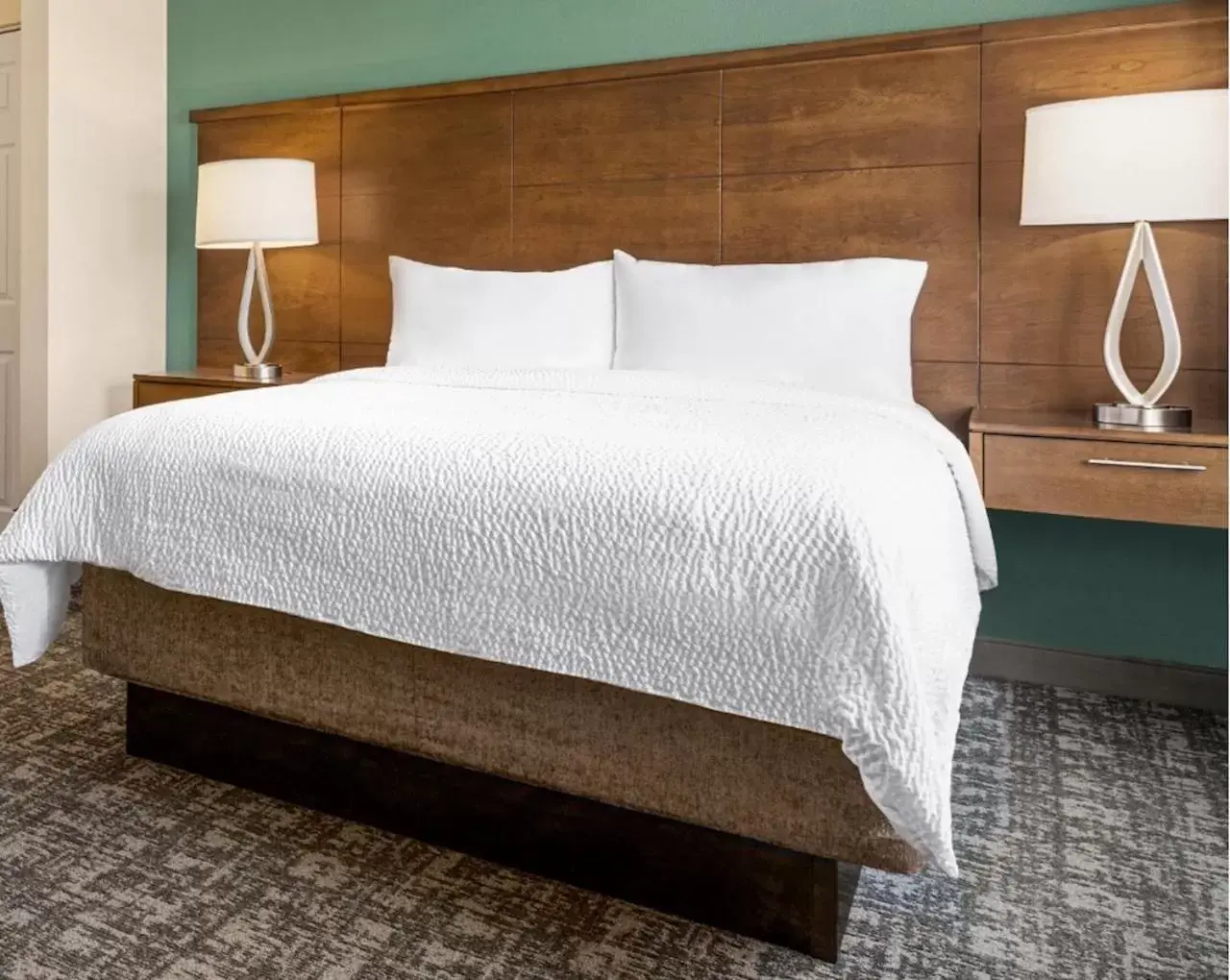 Bed in Staybridge Suites Oklahoma City-Quail Springs, an IHG Hotel