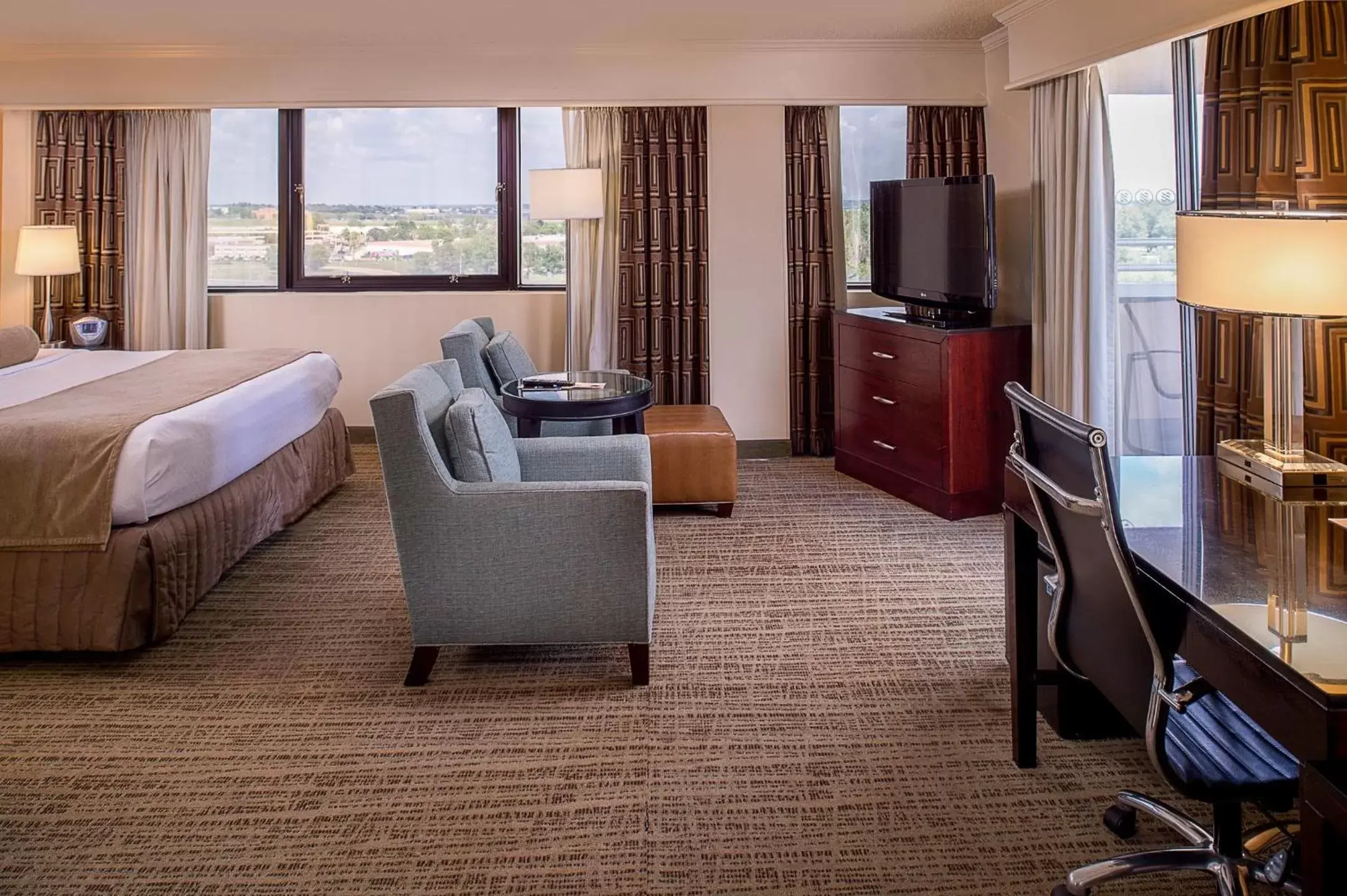 Bedroom, Seating Area in Crowne Plaza Hotel St. Louis Airport, an IHG Hotel