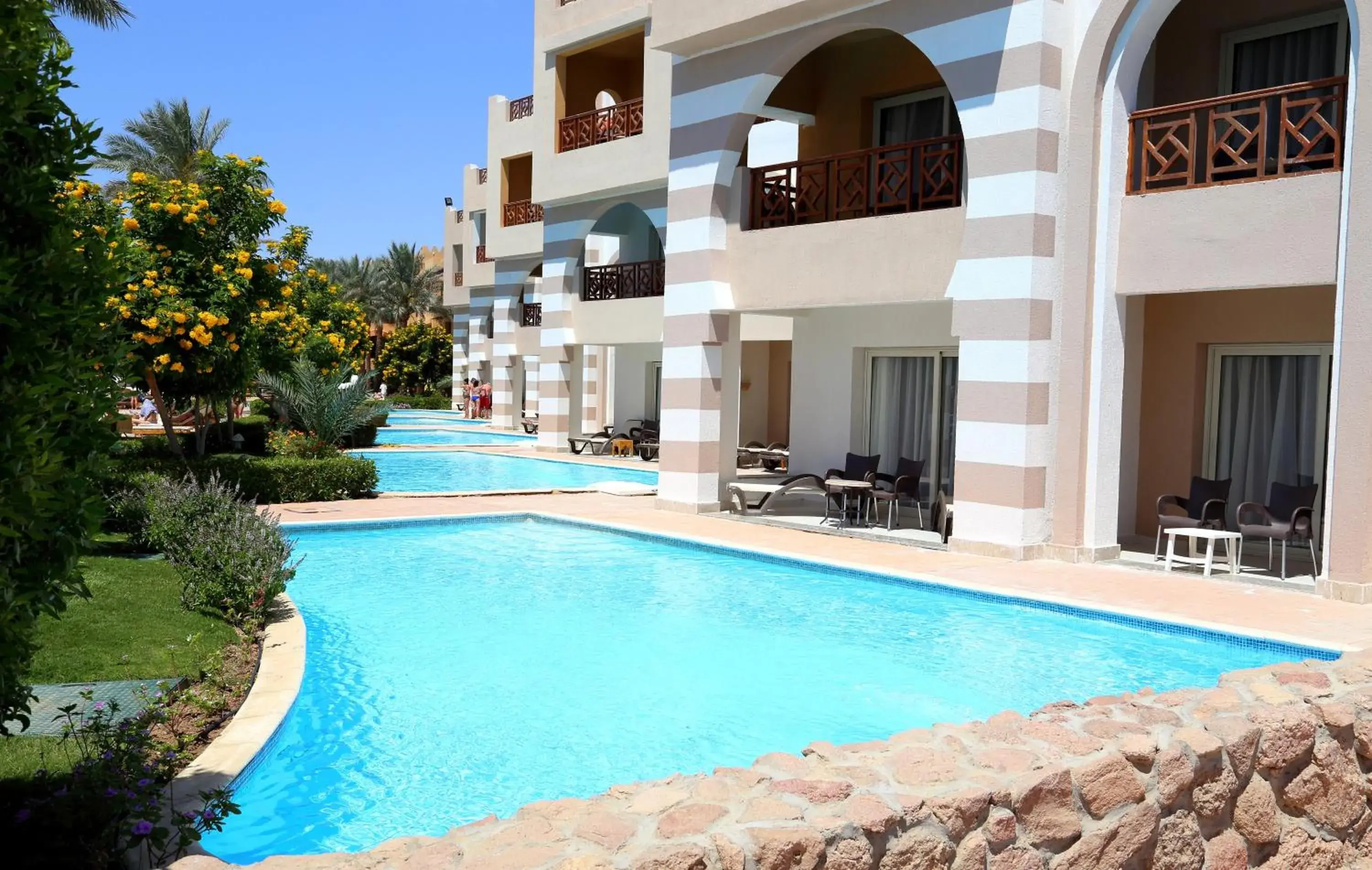 Swimming pool, Property Building in Rehana Royal Beach Resort - Aquapark & Spa - Family & Couples Only