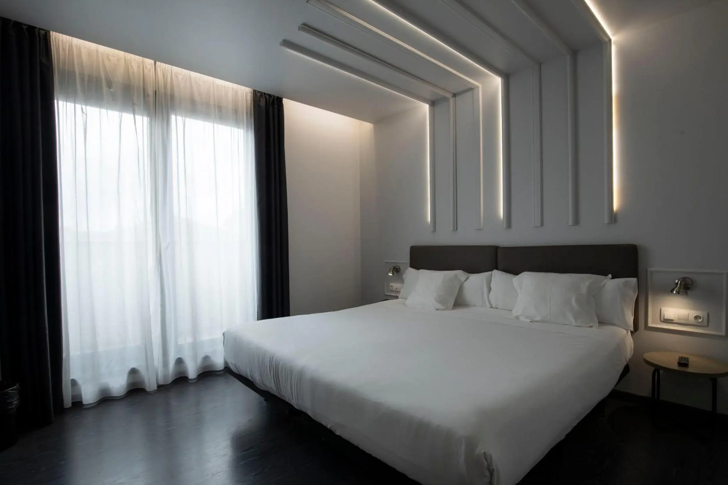 Photo of the whole room, Bed in Hotel Lux Santiago