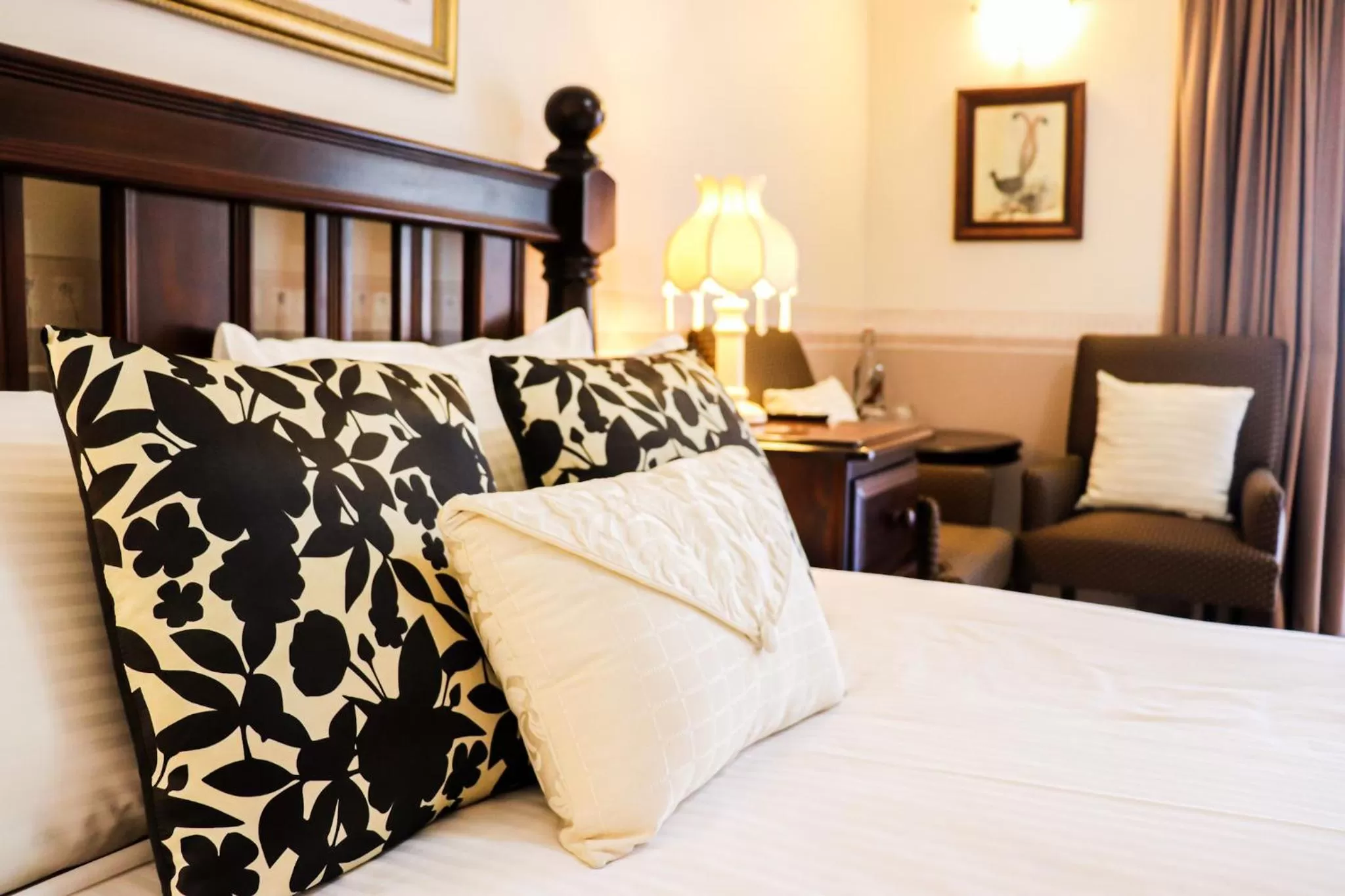 Bed in Plumes Boutique Bed & Breakfast