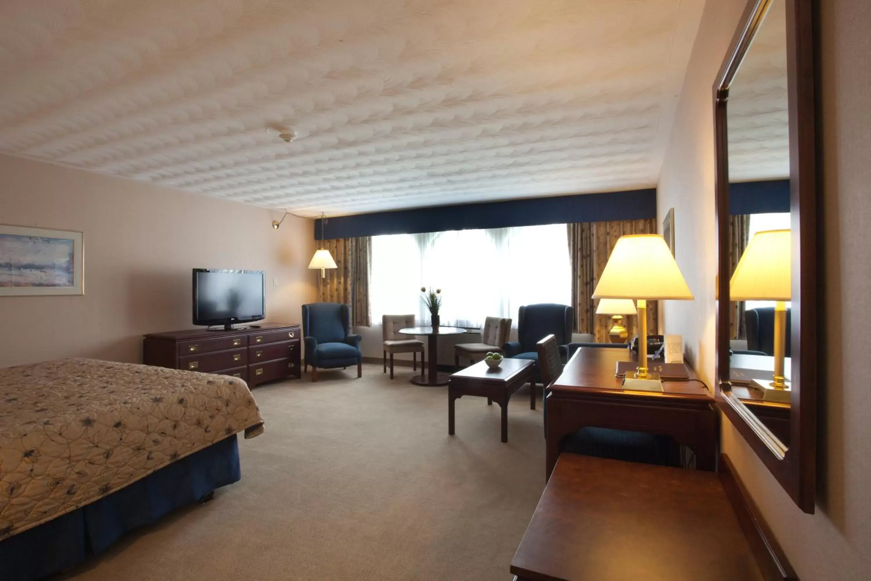 Photo of the whole room, Seating Area in The Fredericton Inn