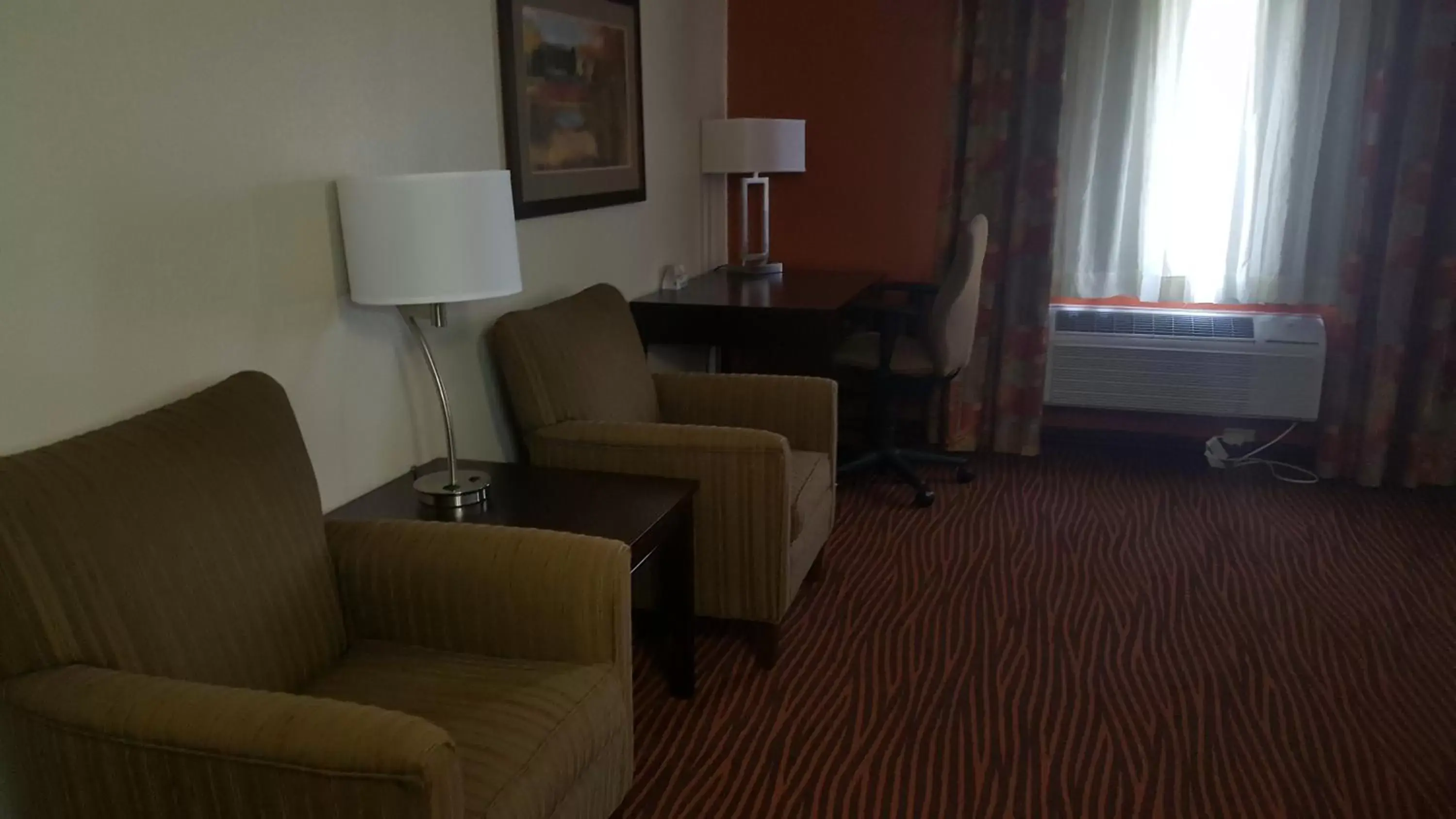 Seating Area in AmericInn by Wyndham Muscatine