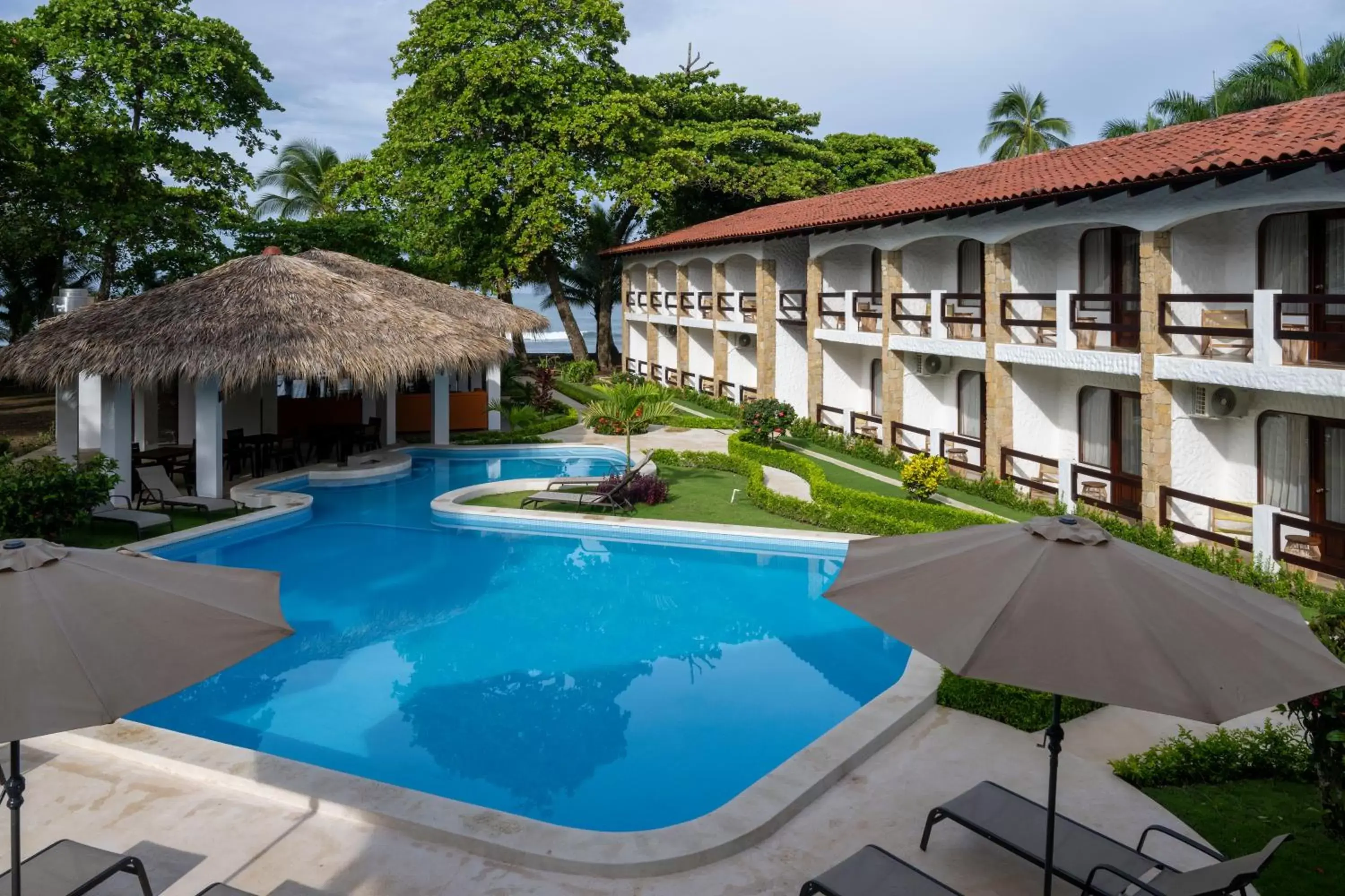 Garden view, Swimming Pool in Fuego del Sol Beachfront Hotel