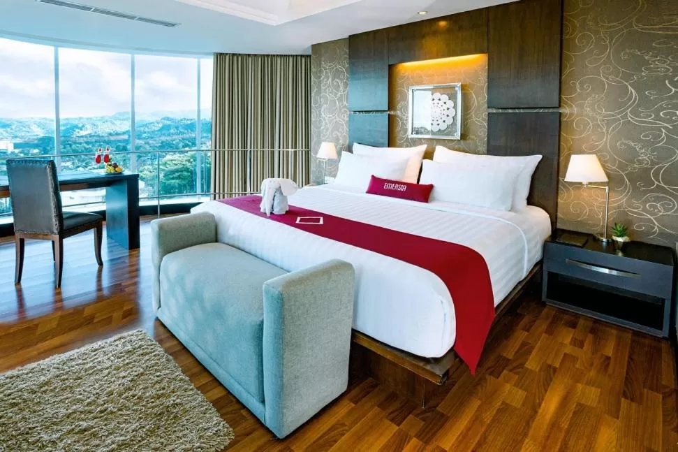 Bed in Emersia Hotel and Resort