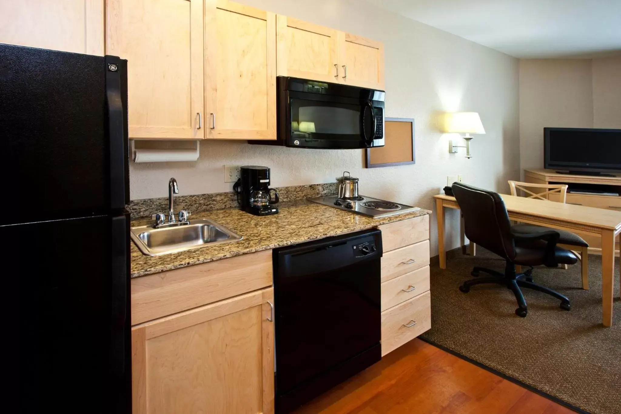 Bedroom, Kitchen/Kitchenette in Candlewood Suites Fort Myers Interstate 75, an IHG Hotel