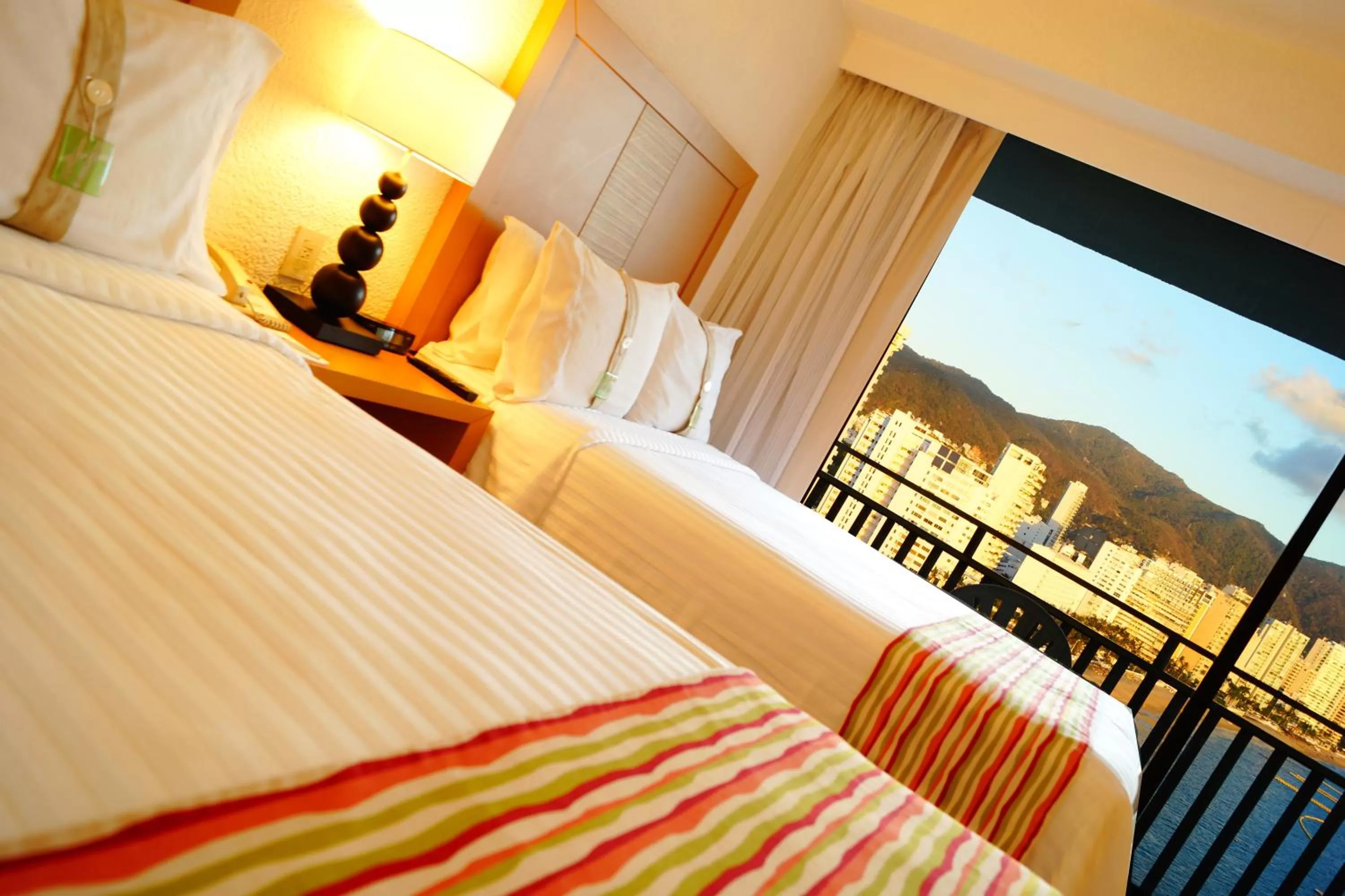 Bed in Holiday Inn Resort Acapulco, an IHG Hotel