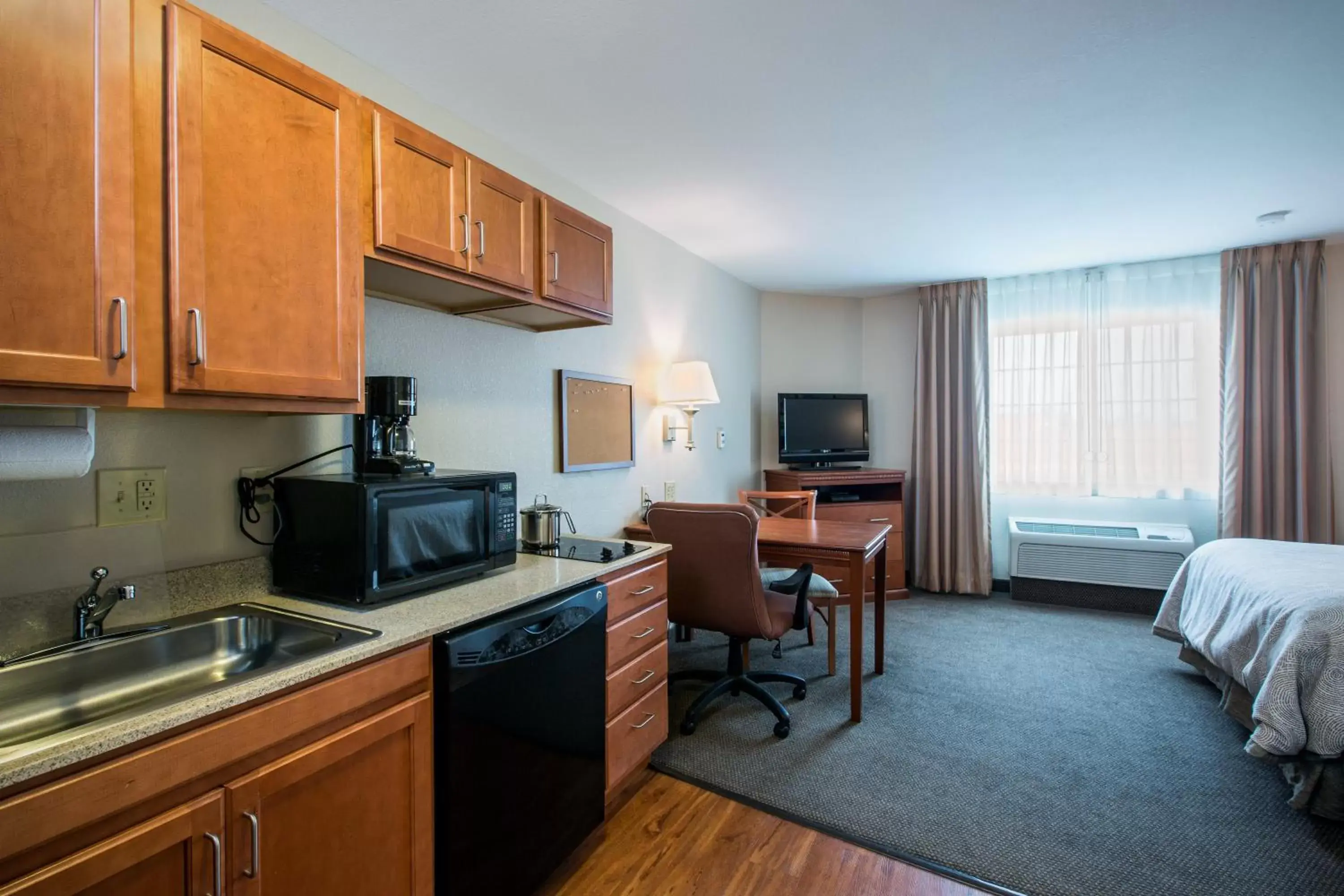 Photo of the whole room, Kitchen/Kitchenette in Candlewood Suites Indianapolis Northwest, an IHG Hotel