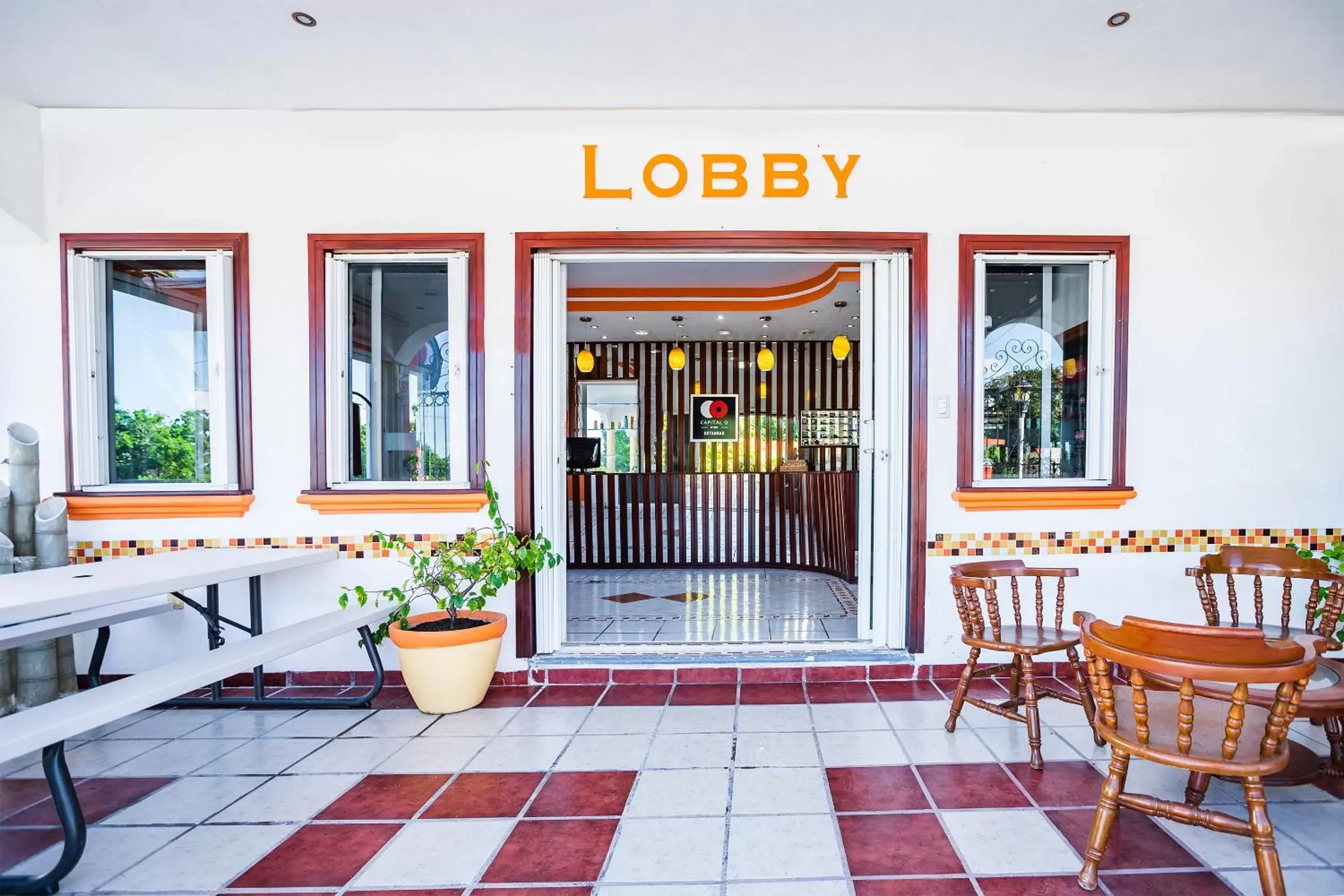 Lobby or reception in Capital O Oxtankah,chetumal bay
