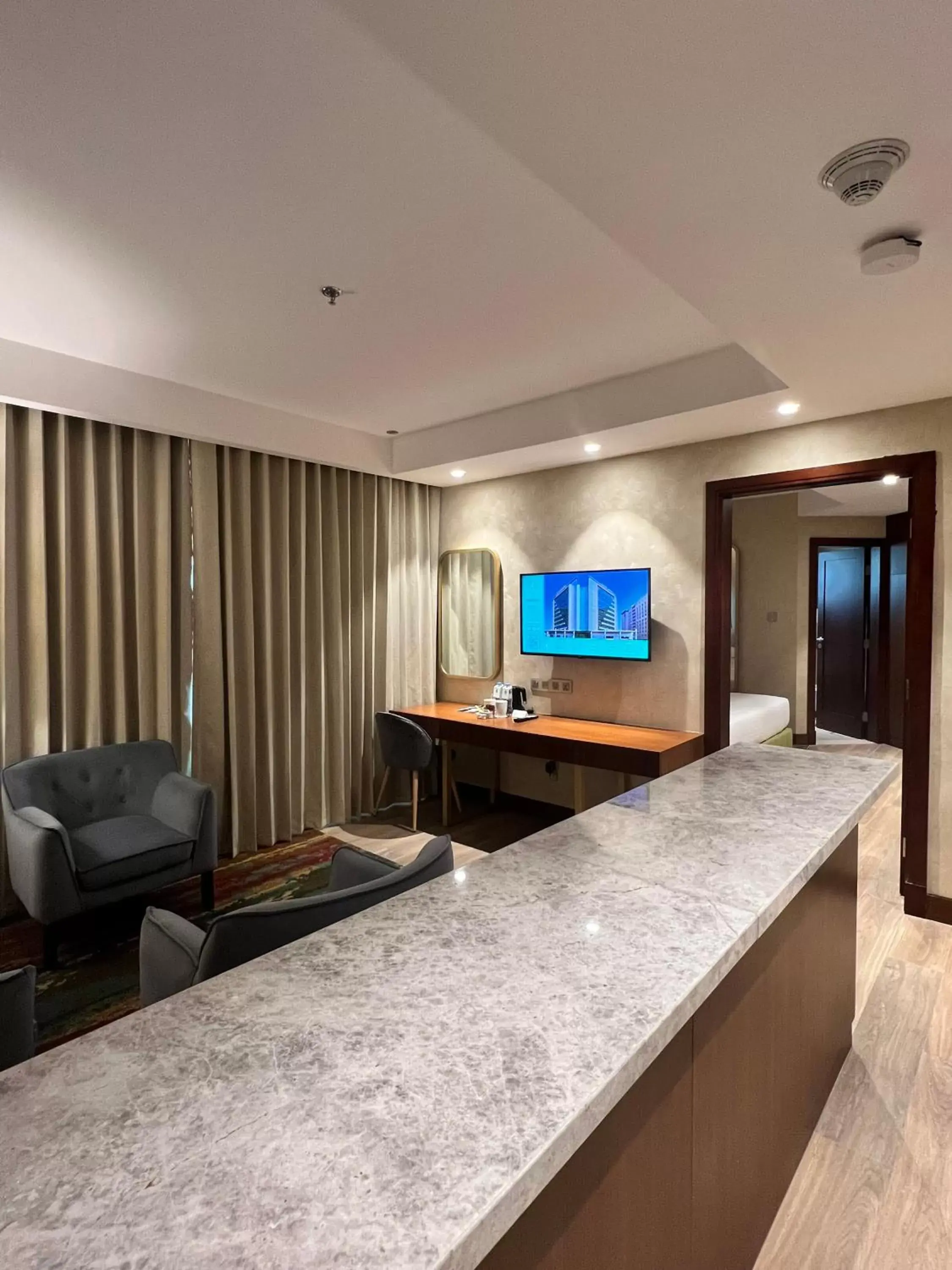 Living room, Lobby/Reception in City Seasons Suites