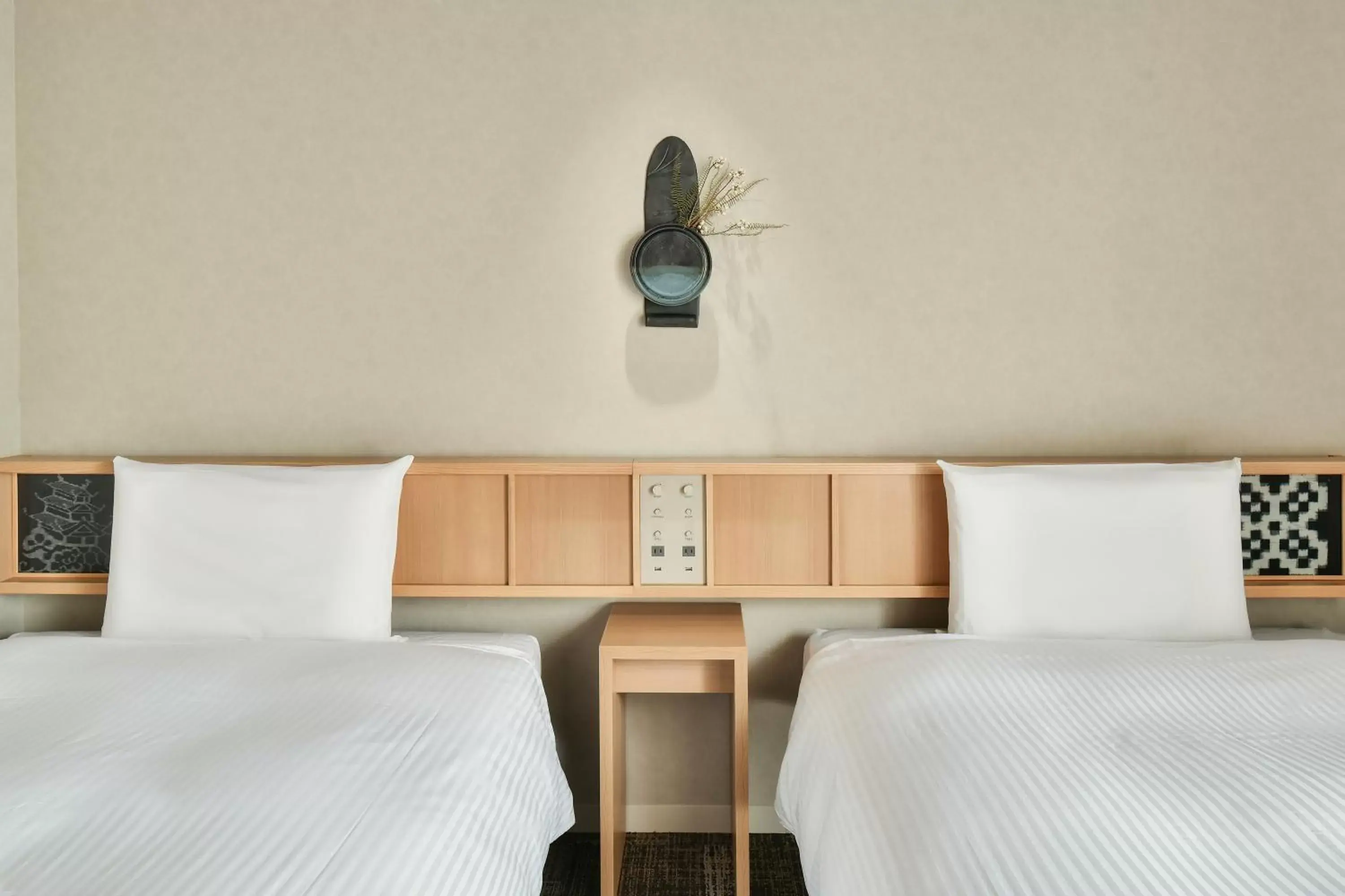 Bed in REF Matsuyama City Station by VESSEL HOTELS