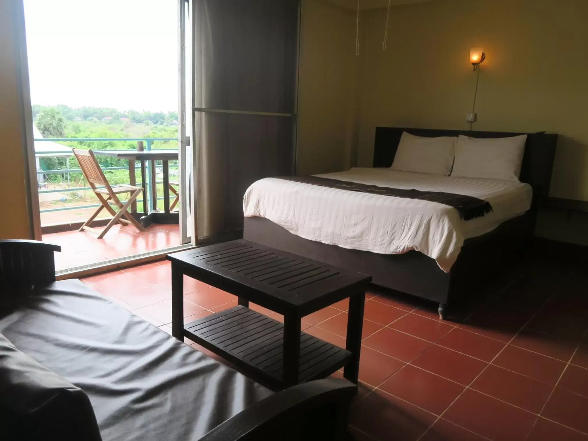 Bed in River Dolphin Hotel