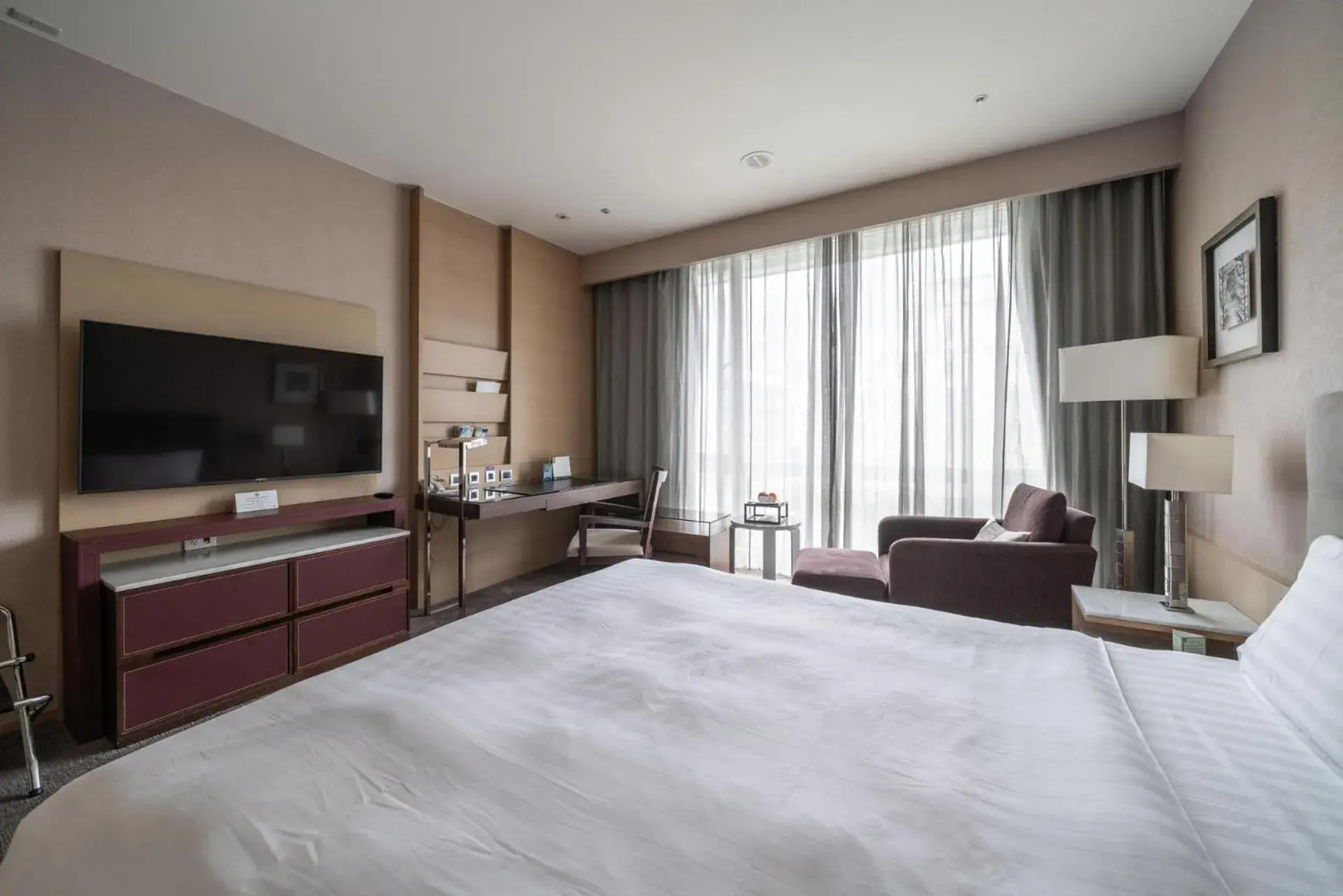 Bed in Taipung Suites