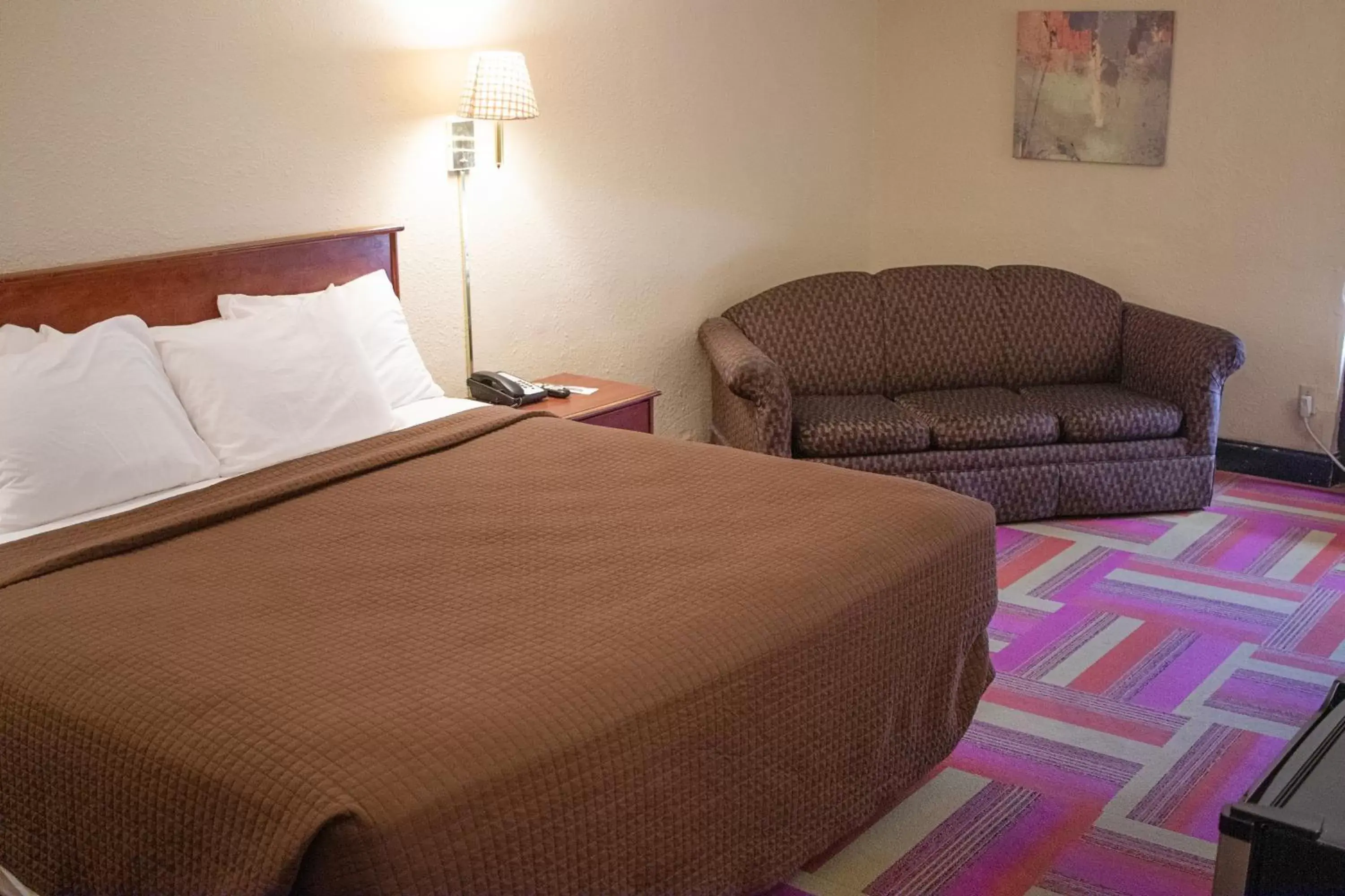 Bed in The Inn and Suites at 34 Fifty