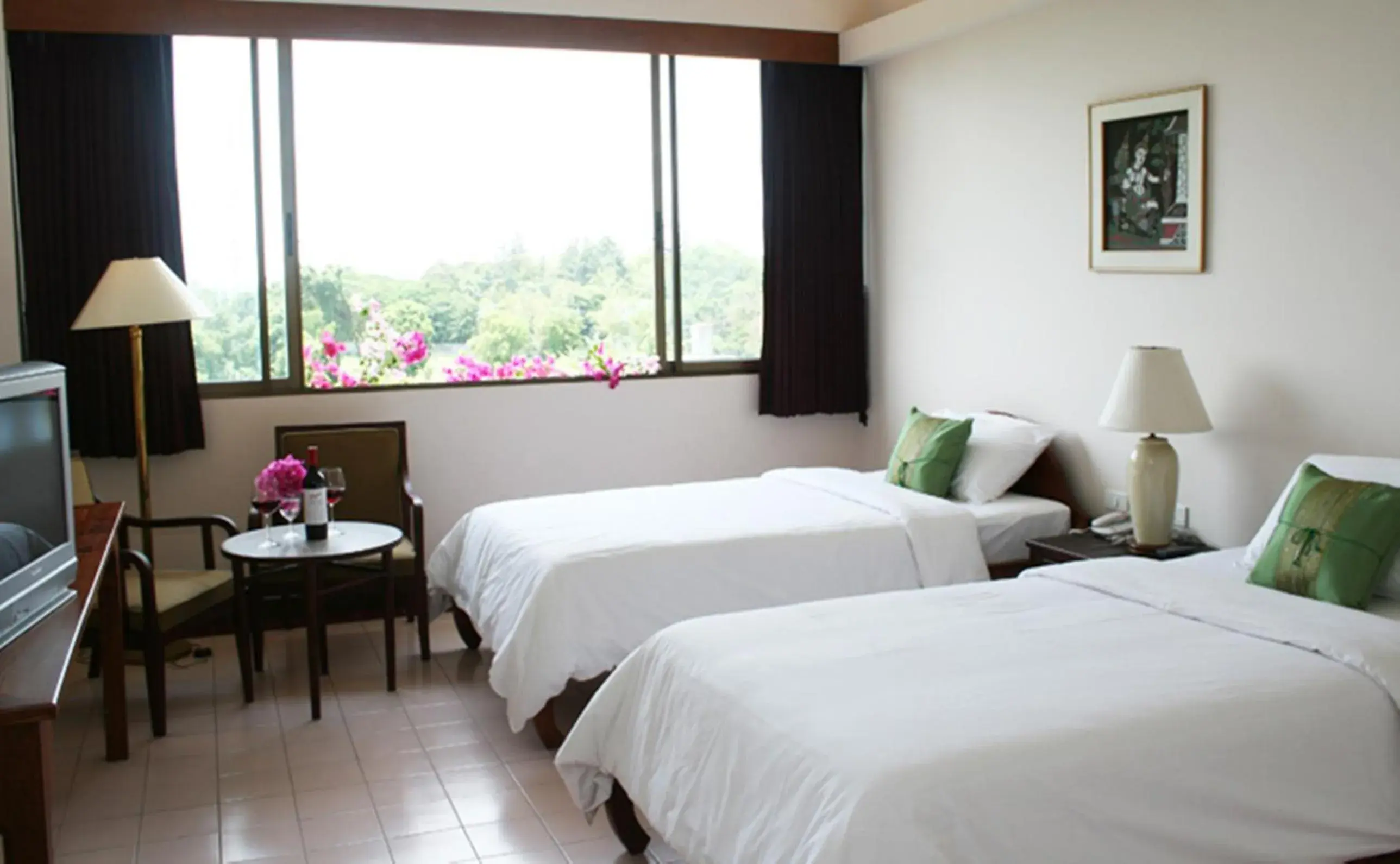 Bed in Mae Pim Resort Hotel