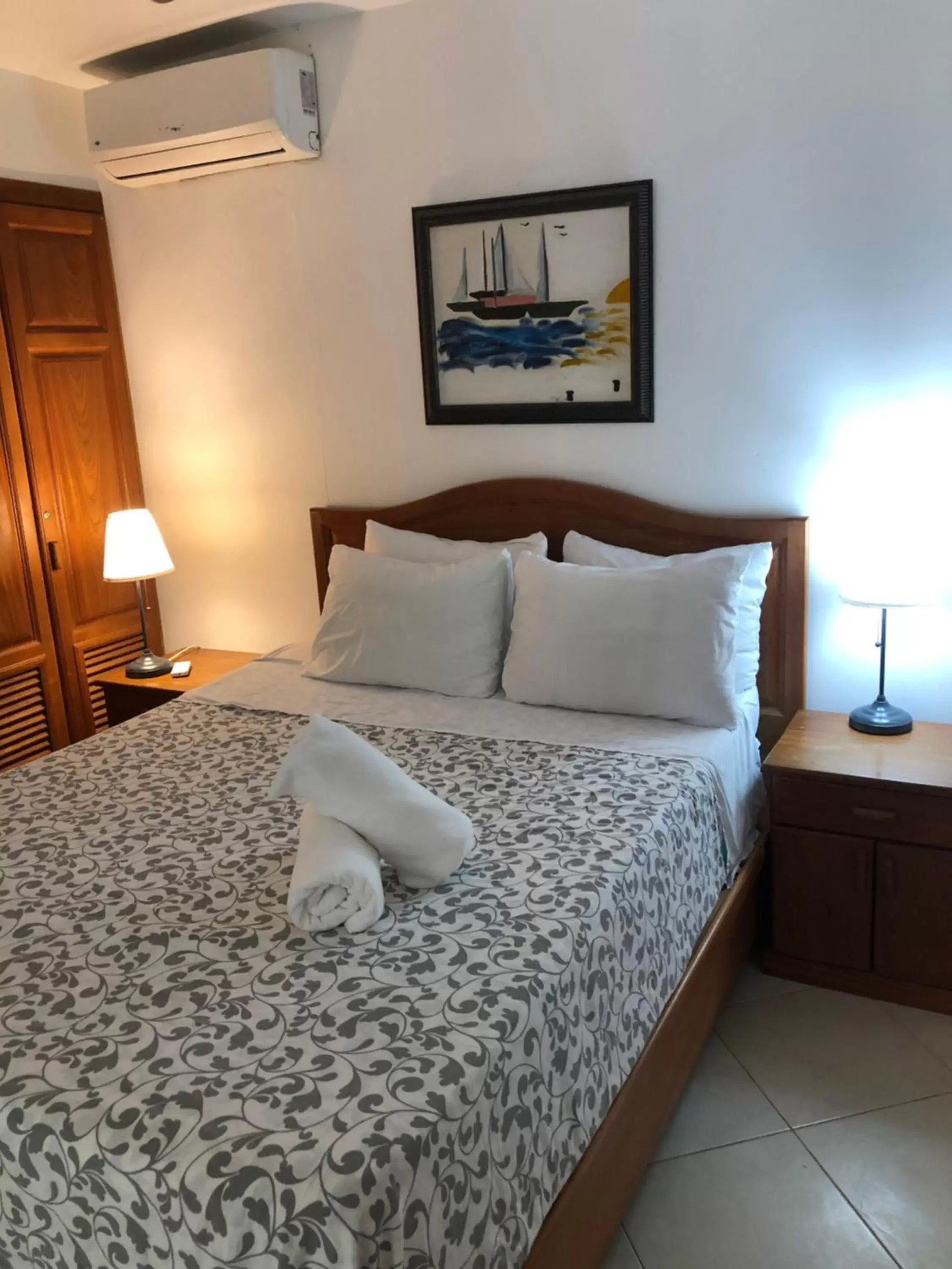 Bed in Los Corales Luxury Villas Beach Club and Spa