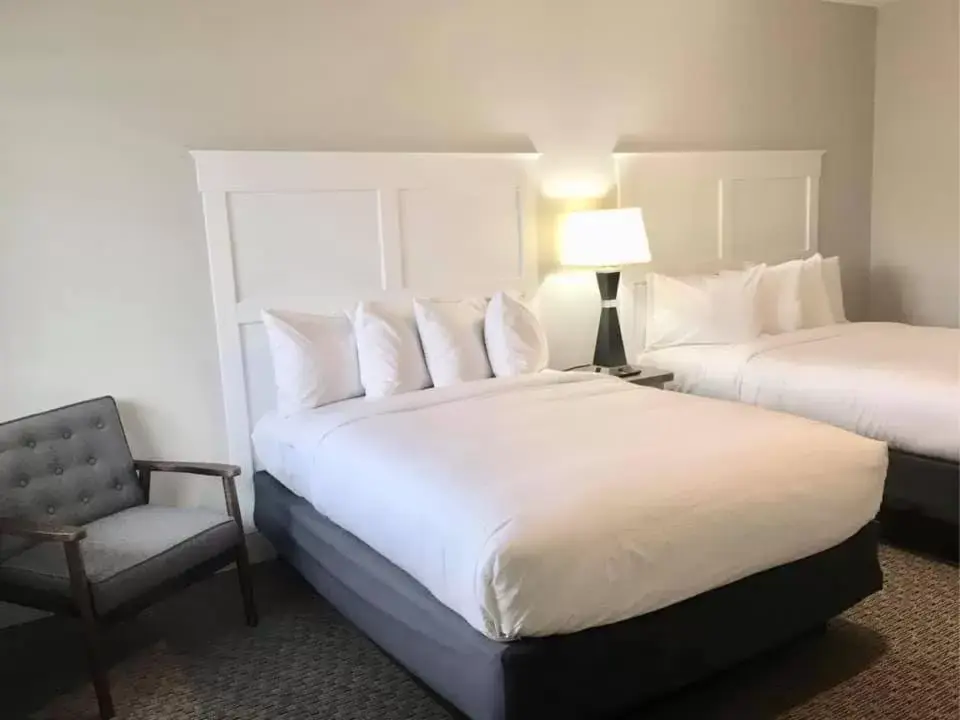 Bed in Empire Lakeshore Inn