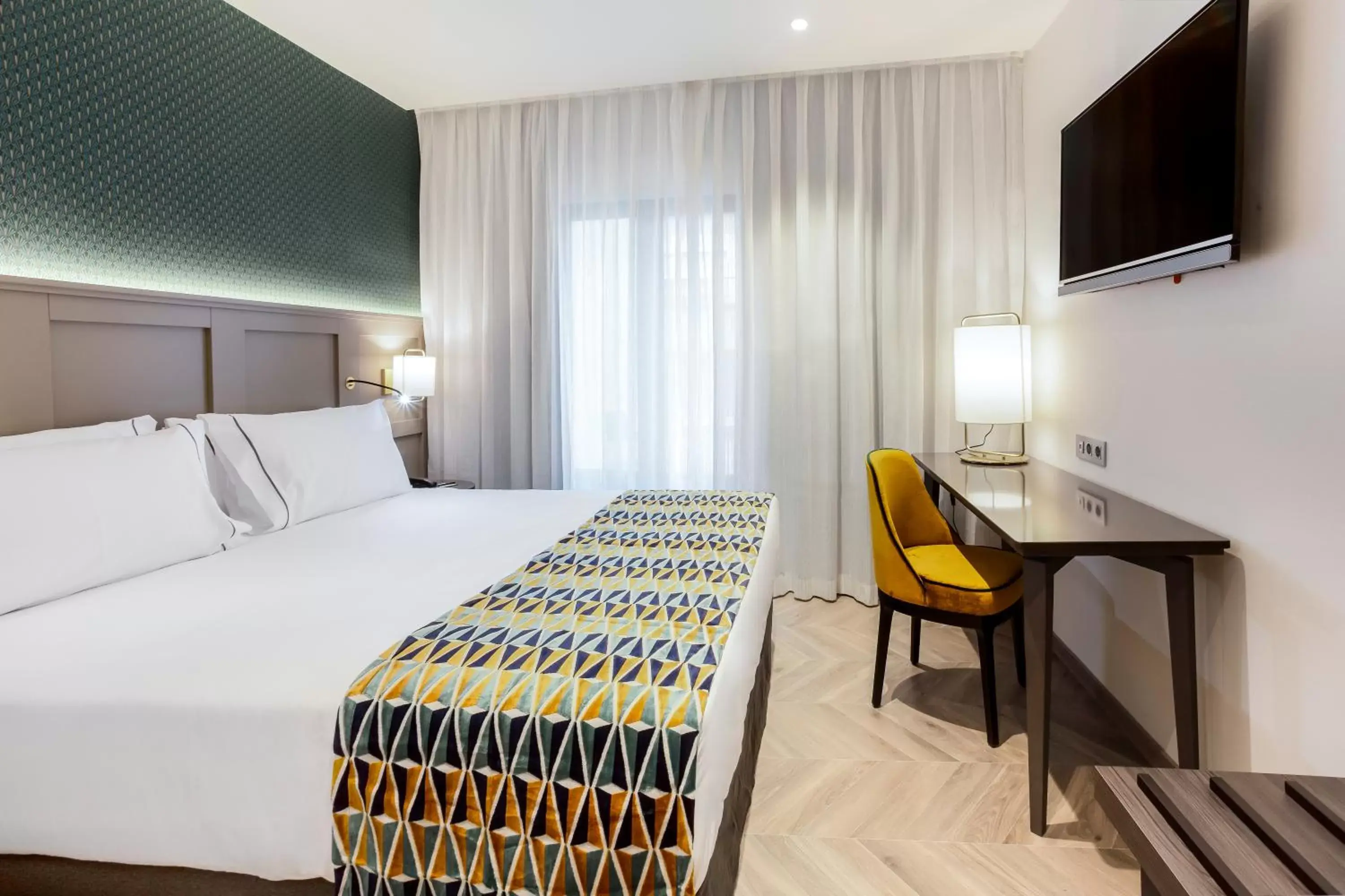 Photo of the whole room, Bed in Eurostars Puerta Real