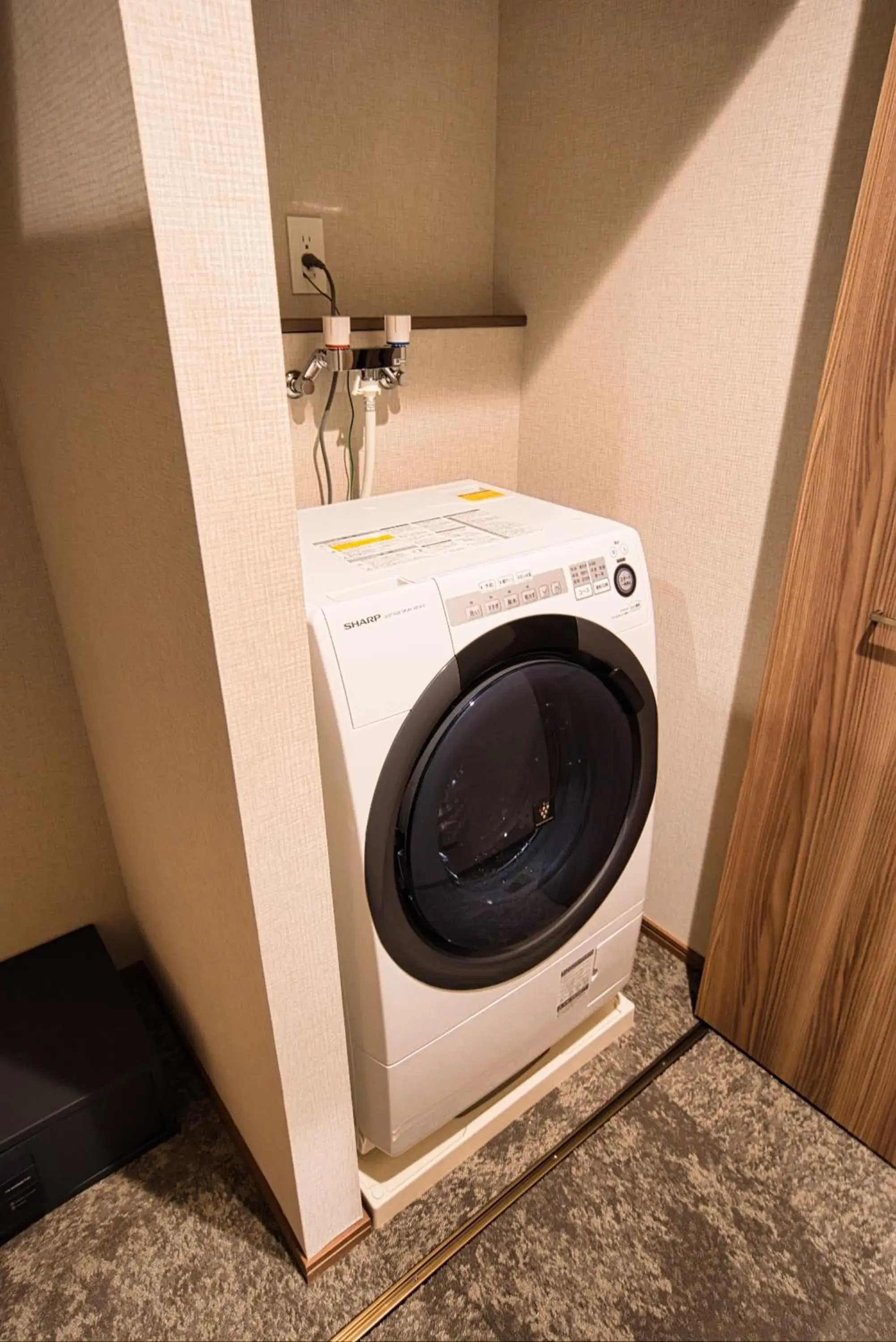 washing machine, Bathroom in Winery Hotel and Condominium HITOHANA