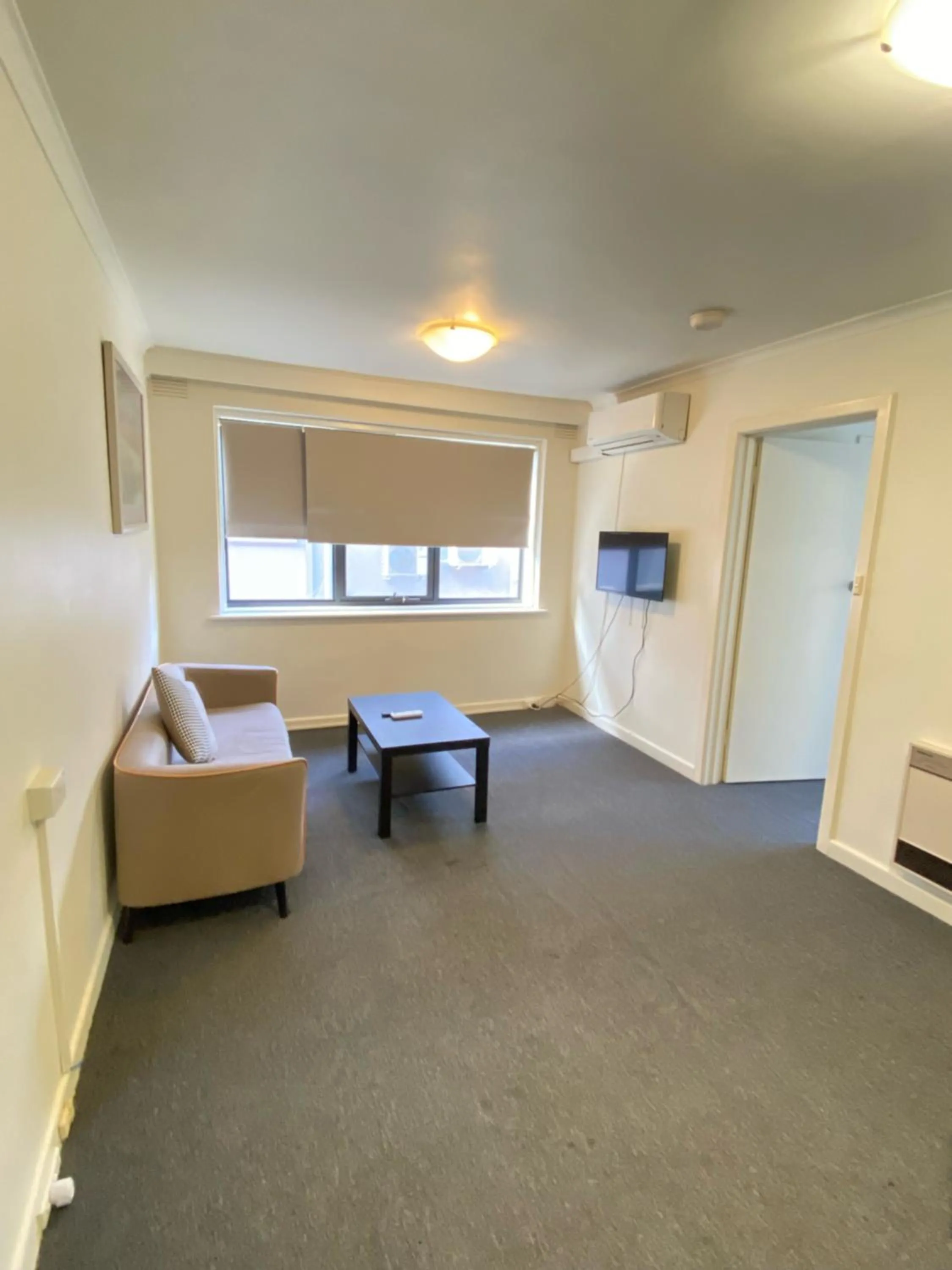 Living room, Bed in City Edge East Melbourne Apartment Hotel