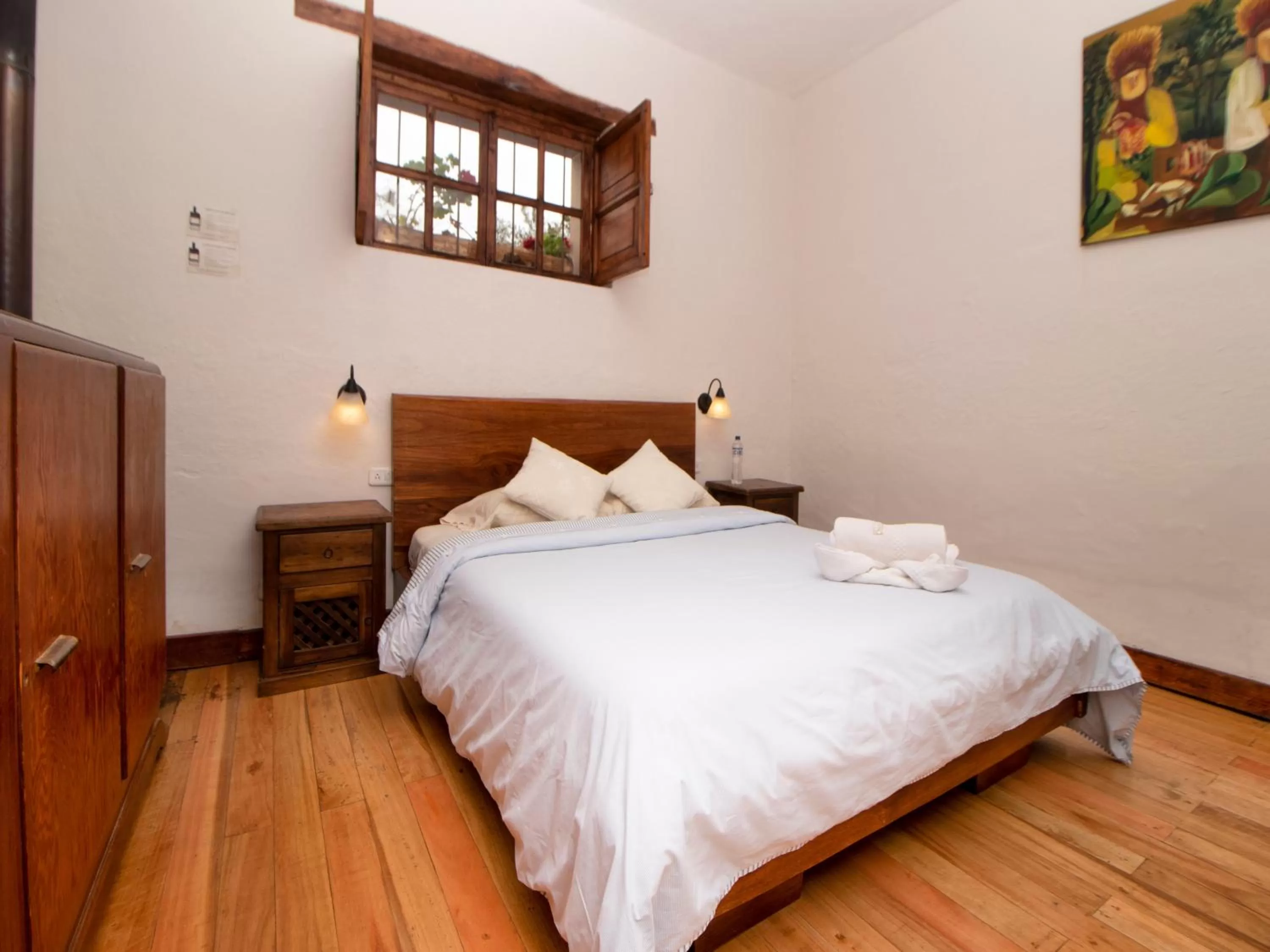 Bed in Hosteria Papagayo Cotopaxi