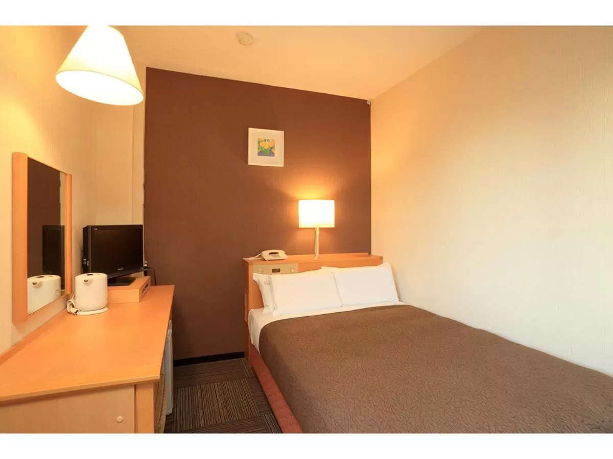 Bed in Smile Hotel Shizuoka