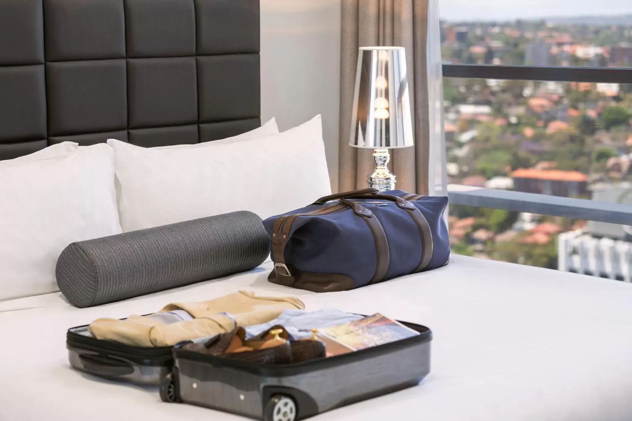 Bed in Meriton Suites North Sydney