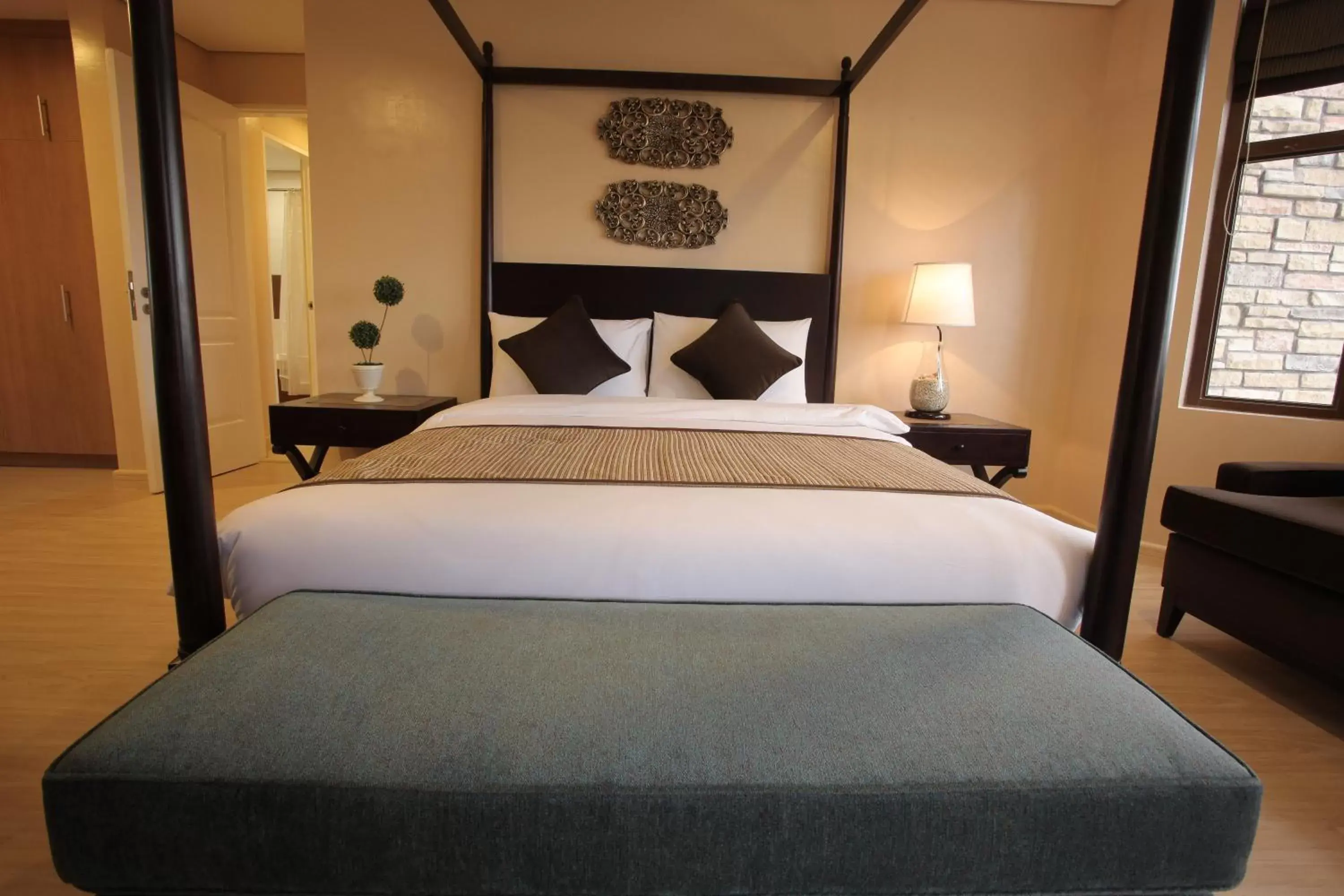 Bed in Crosswinds Resort Suites