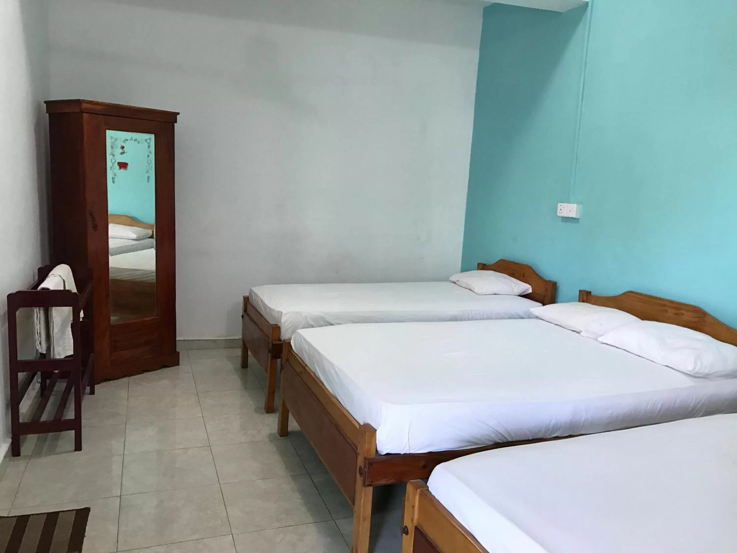 Bed in Gnaanams Hotel and Restaurant