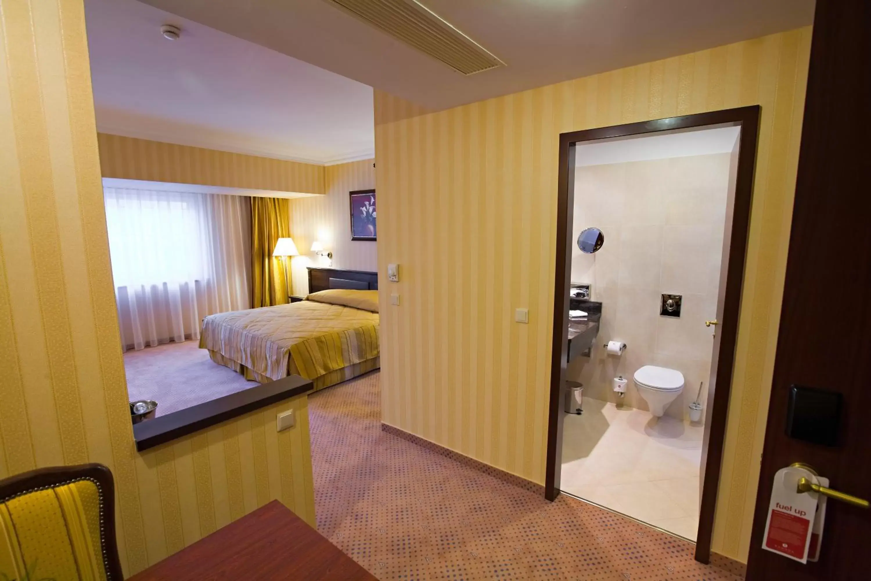 Photo of the whole room, Bed in Ramada Hotel & Suites by Wyndham Bucharest North