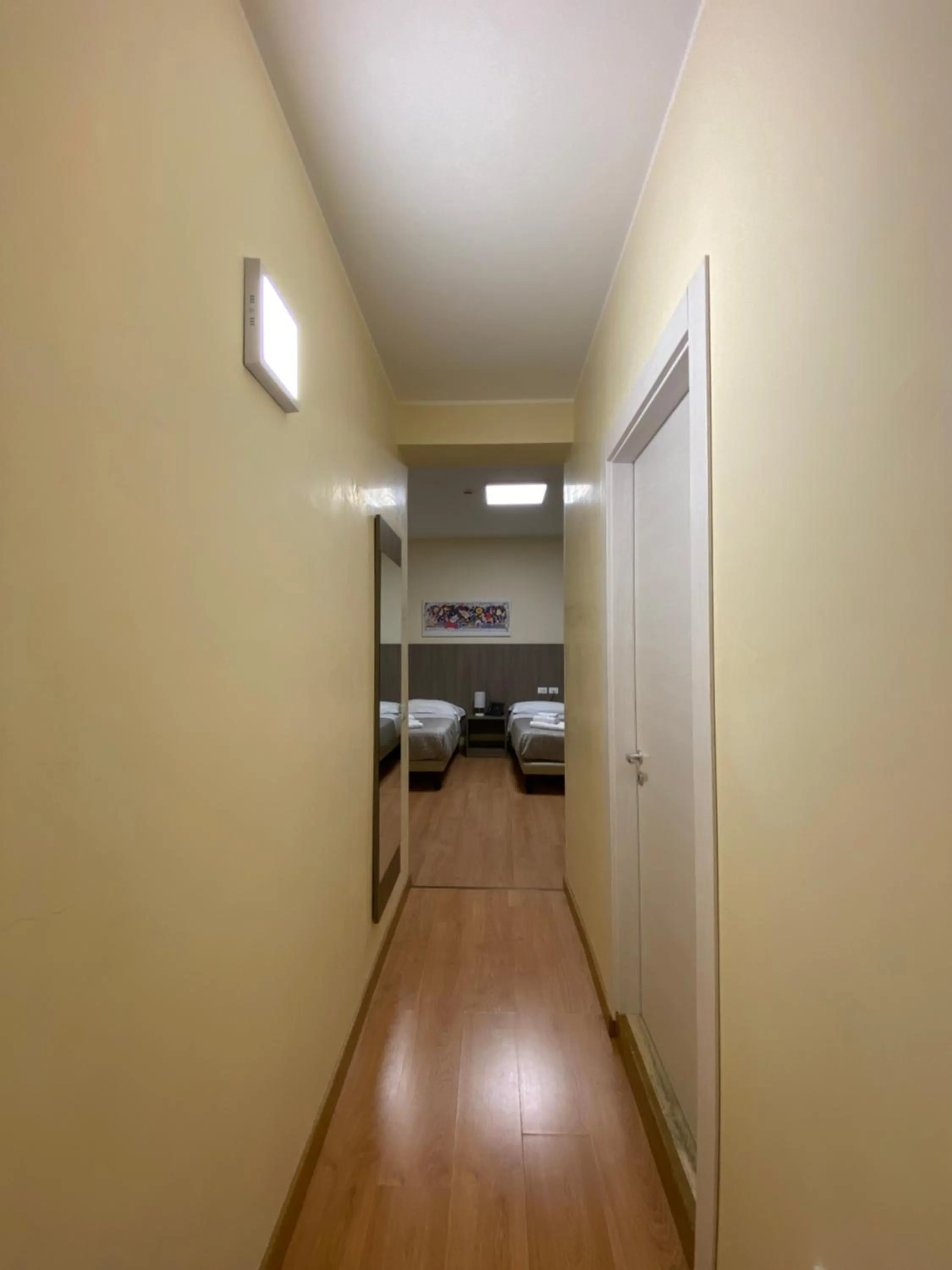 Bed in 55 Aira Hotel