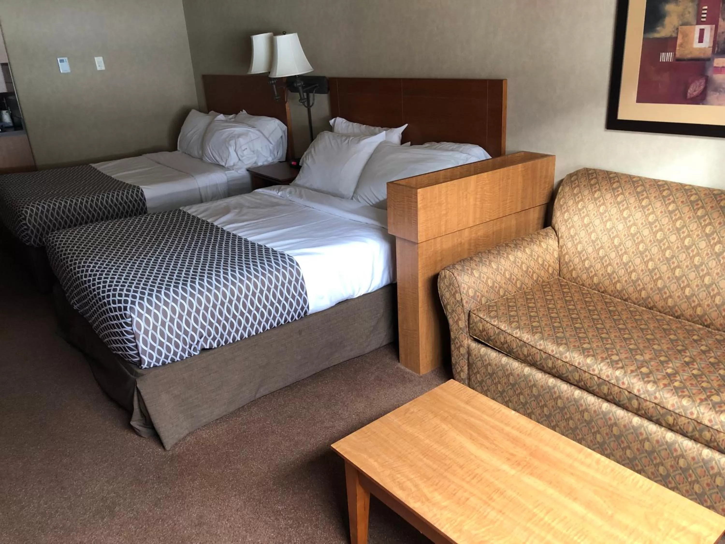Swimming pool, Bed in Ramada by Wyndham Ponoka