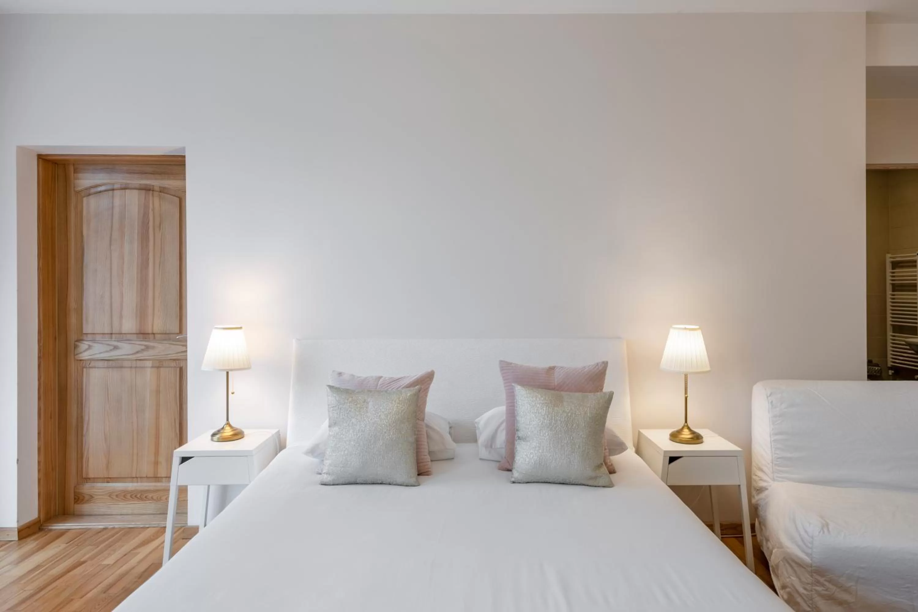 Bed in Vilnius Apartments