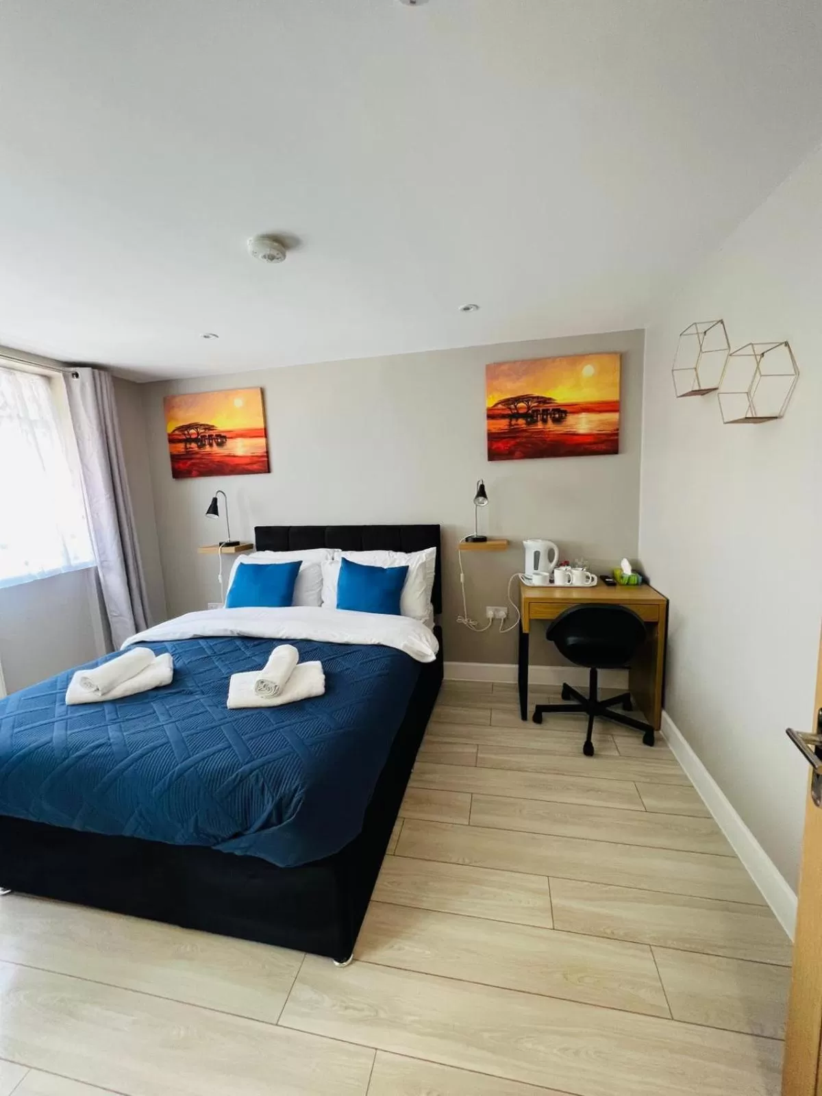 Photo of the whole room, Bed in Indigo Suites