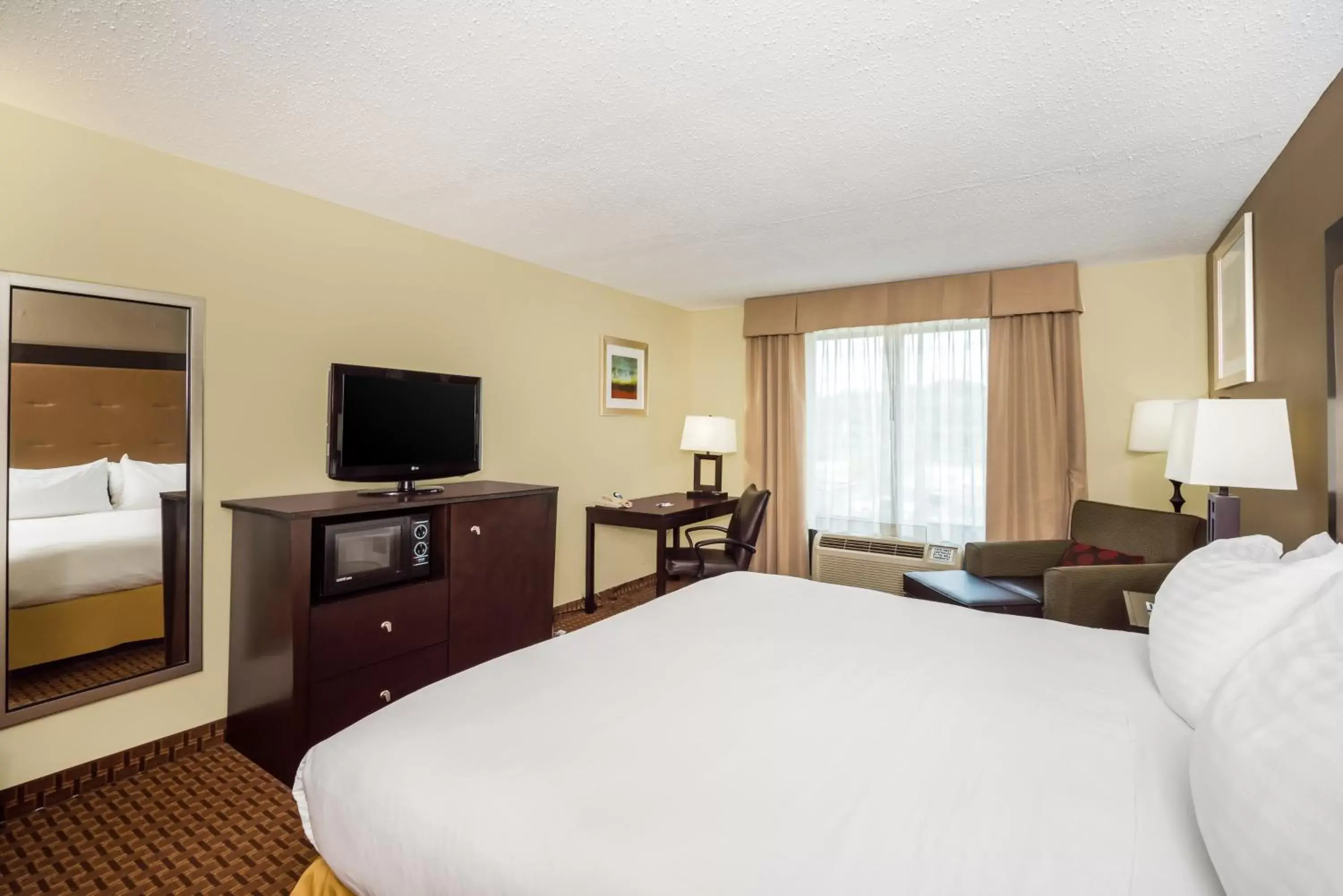 Photo of the whole room, TV/Entertainment Center in Holiday Inn Express Hotel & Suites-North East, an IHG Hotel