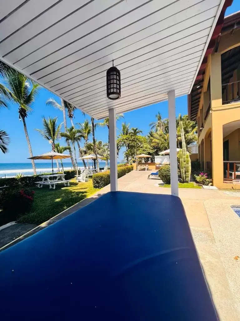 Swimming Pool in The Backyard Beachfront Hotel